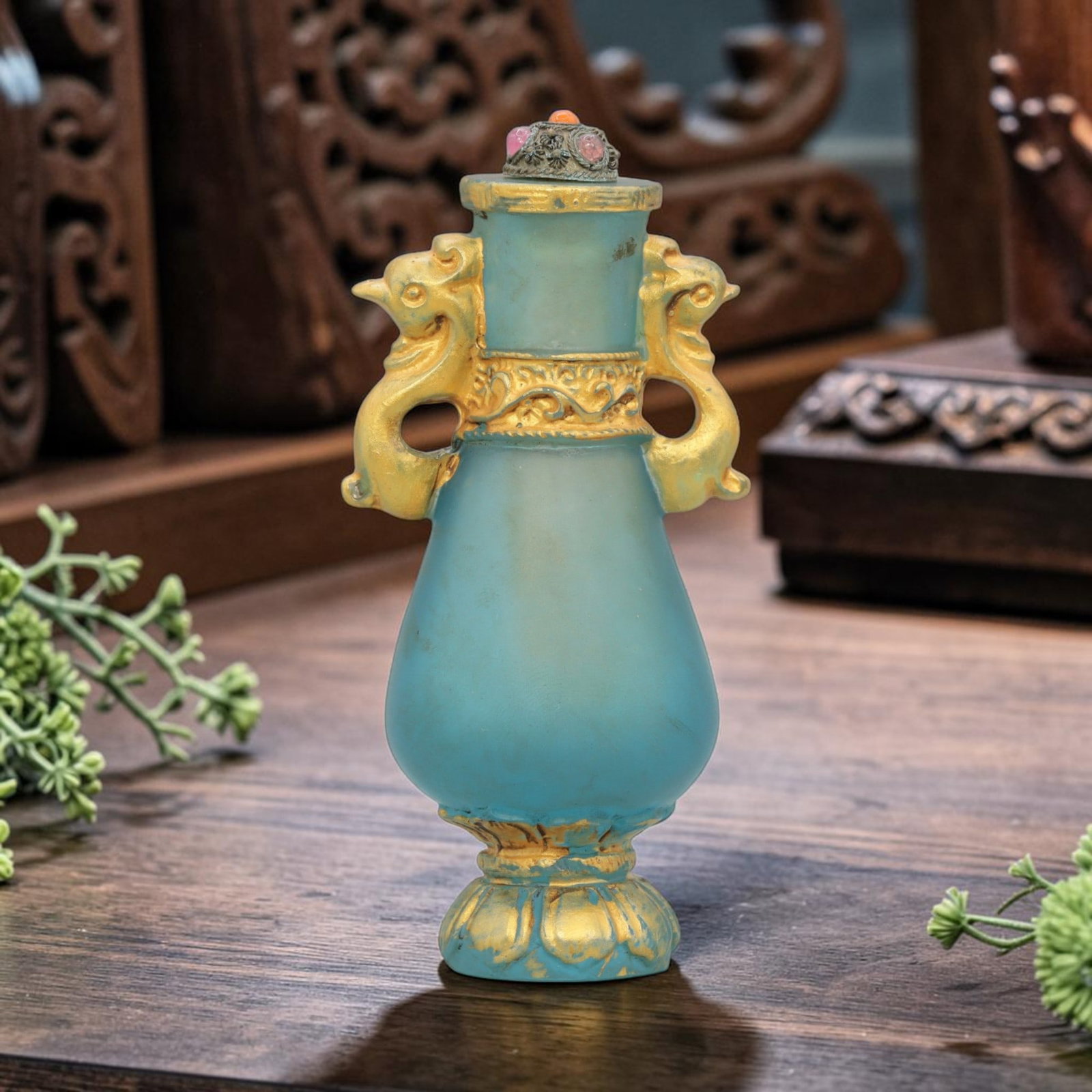 Vintage Chinese Blue Liuli Snuff Bottle - Gilt Phoenix Handles, 64YF: Crafted from frosted sky-blue liuli glass, this snuff bottle features a vase-shaped body with ornate gilded phoenix-head handles and lotus-inspired base detailing. The neck is accented with gilded flo