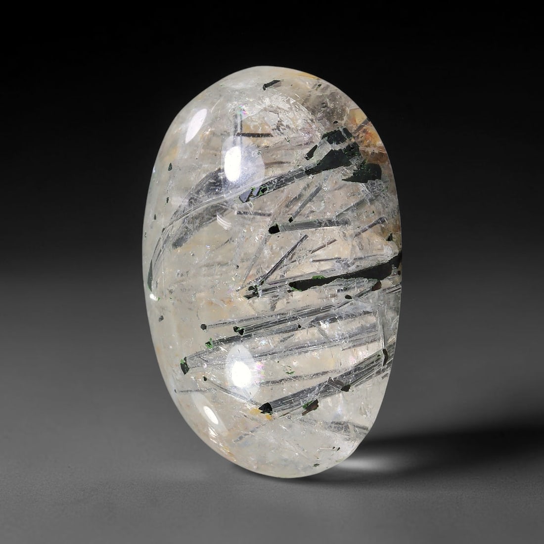 29.66ct Natural Brazilian Black Rutile Quartz Cabochon Loose Gemstone, 7YX: This polished cabochon of natural rutile quartz features countless distinct slender black rutile needle inclusions suspended within the clear quartz host crystal. The smooth domed surface enables full