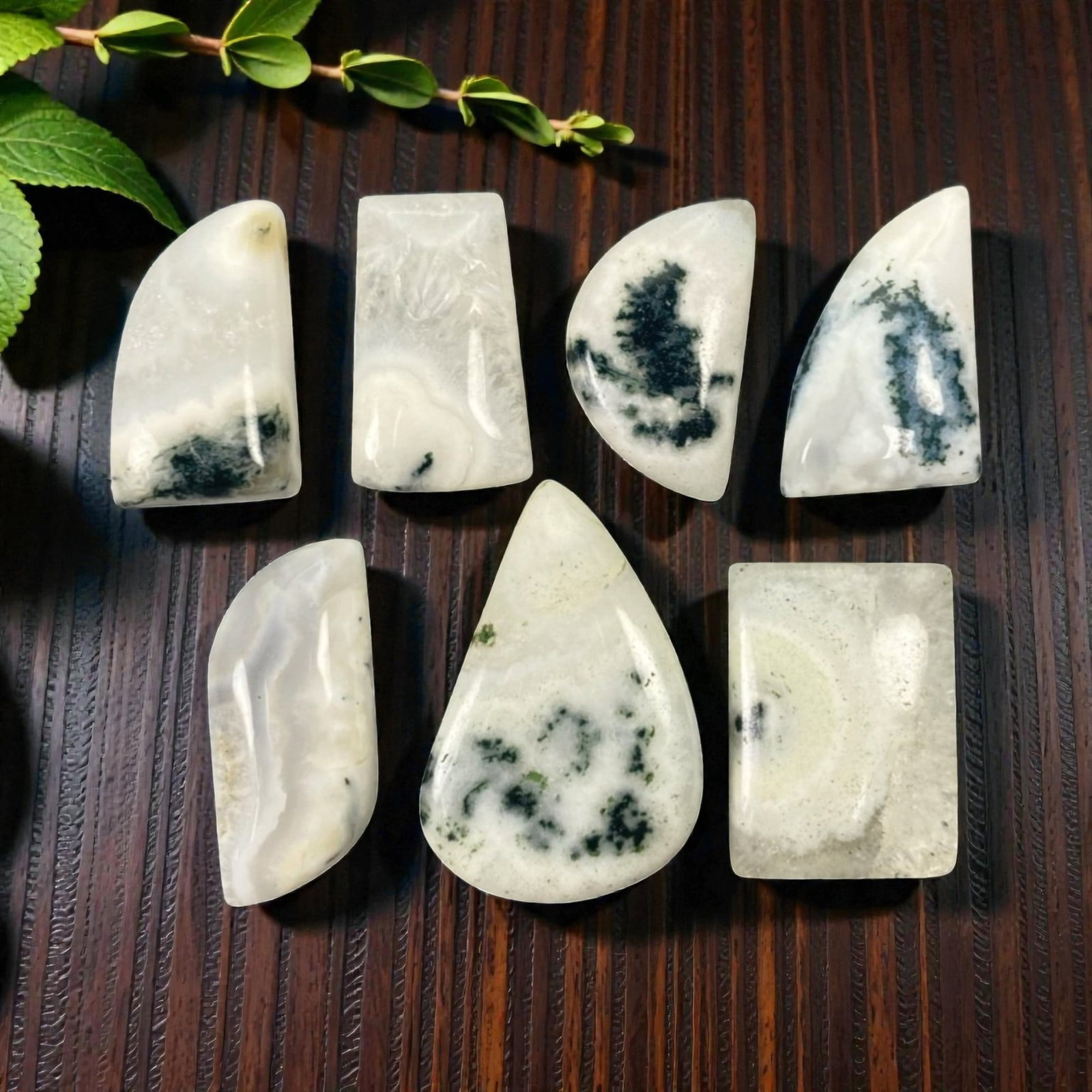 162.99 Carats Solar Quartz Cabochon Parcel - Natural Loose Gemstones, 93ZL: This substantial parcel of solar quartz cabochons, weighing a total of 162.99 carats with individual dimensions ranging from 2.3 to 3.2 cm, showcases the gemstone's ethereal, crystalline beauty. Each 