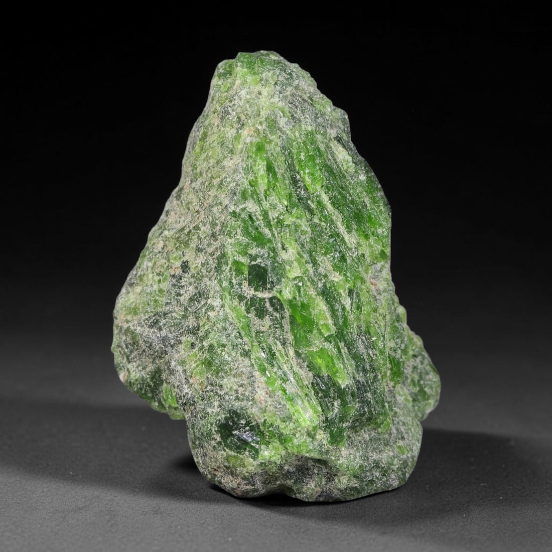 73 Carats Natural Vibrant Green Chrome Diopside Rough Specimen, 27YS: This is an untreated natural chrome diopside mineral specimen formed through natural geological processes, displaying rich green coloration caused by chromium content within its crystalline structure.