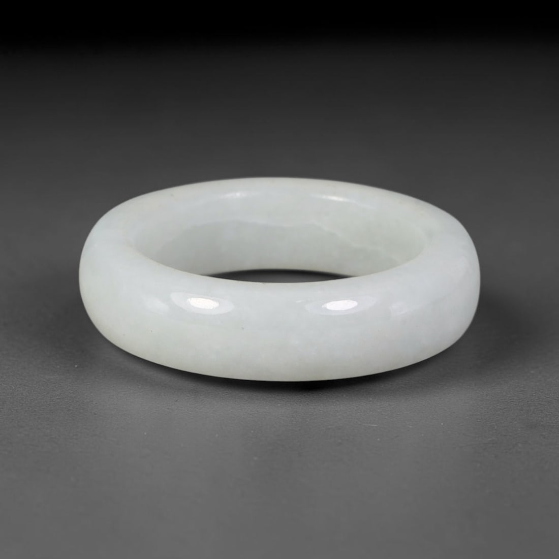 Natural Burmese Type A Jadeite Jade Band Ring Size US 12, 52TB: Crafted from untreated natural Burmese Type A jadeite jade, this solid stone band features a high-gloss polished finish displaying consistent deep green mineral tones interwoven with natural subtle to