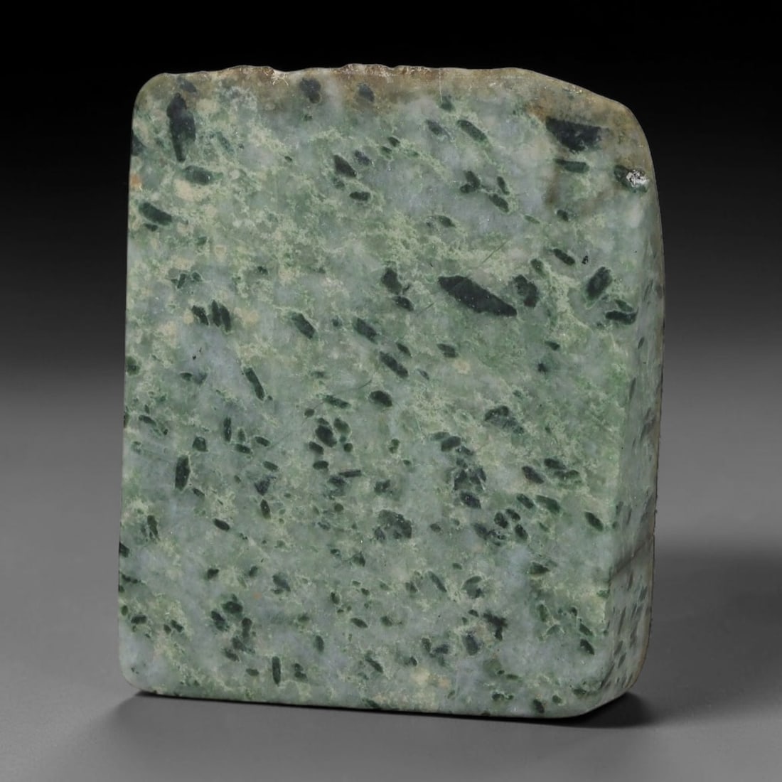 268ct Natural Type A Burmese Jadeite Jade Sliced Rough, 53YK: This specimen is a sliced rough block of natural Type A Burmese jadeite jade. The interior displays natural colour zoning with visible mineral veining and crystalline patterns typical of unprocessed j