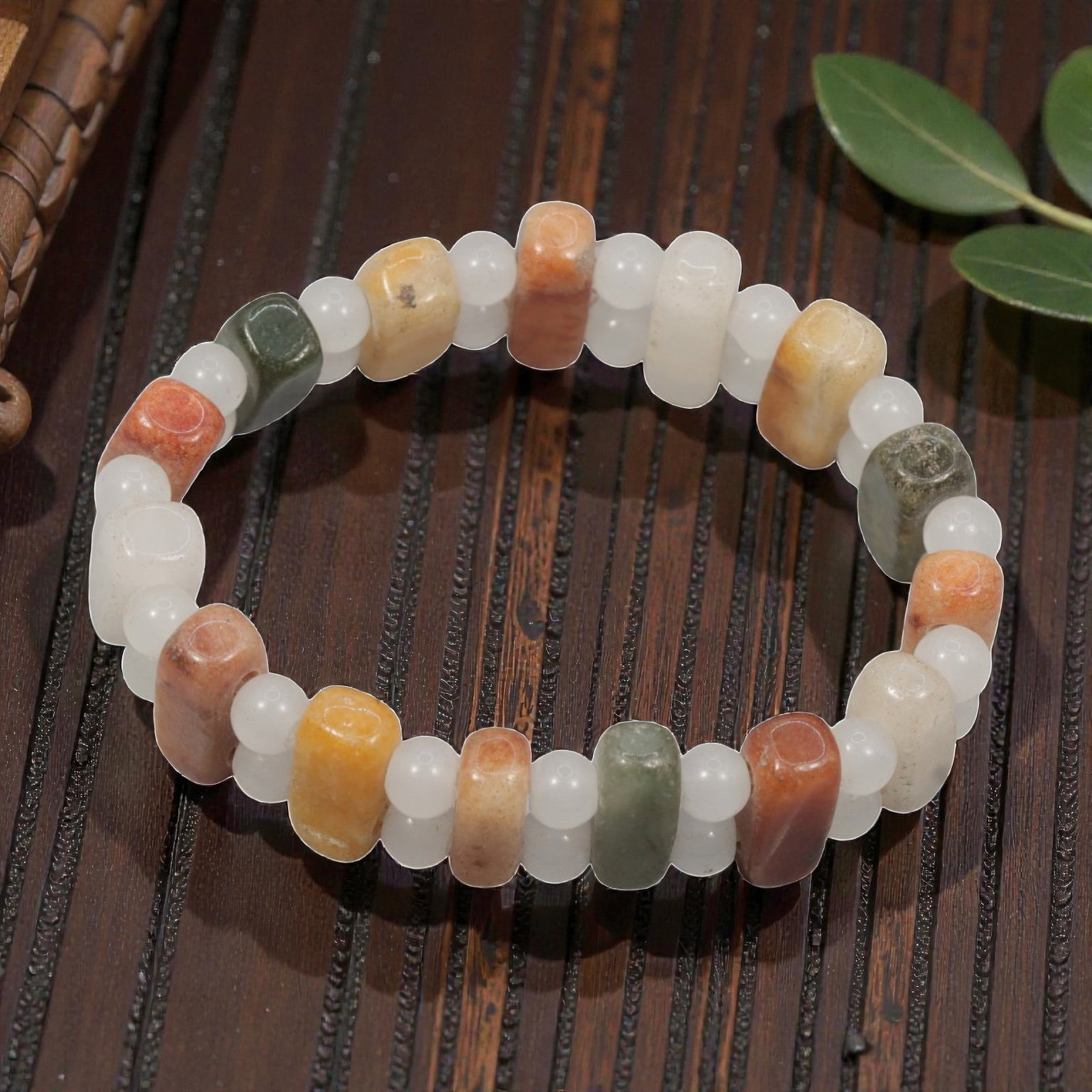 Natural Burmese Type A Jadeite Irregular Rectangle Bead Bracelet, 32ZK: A uniquely hand-strung bracelet featuring polished irregular rectangular natural Burmese Type A jadeite focal beads, paired with small smooth round jadeite spacer beads set between each rectangular pi