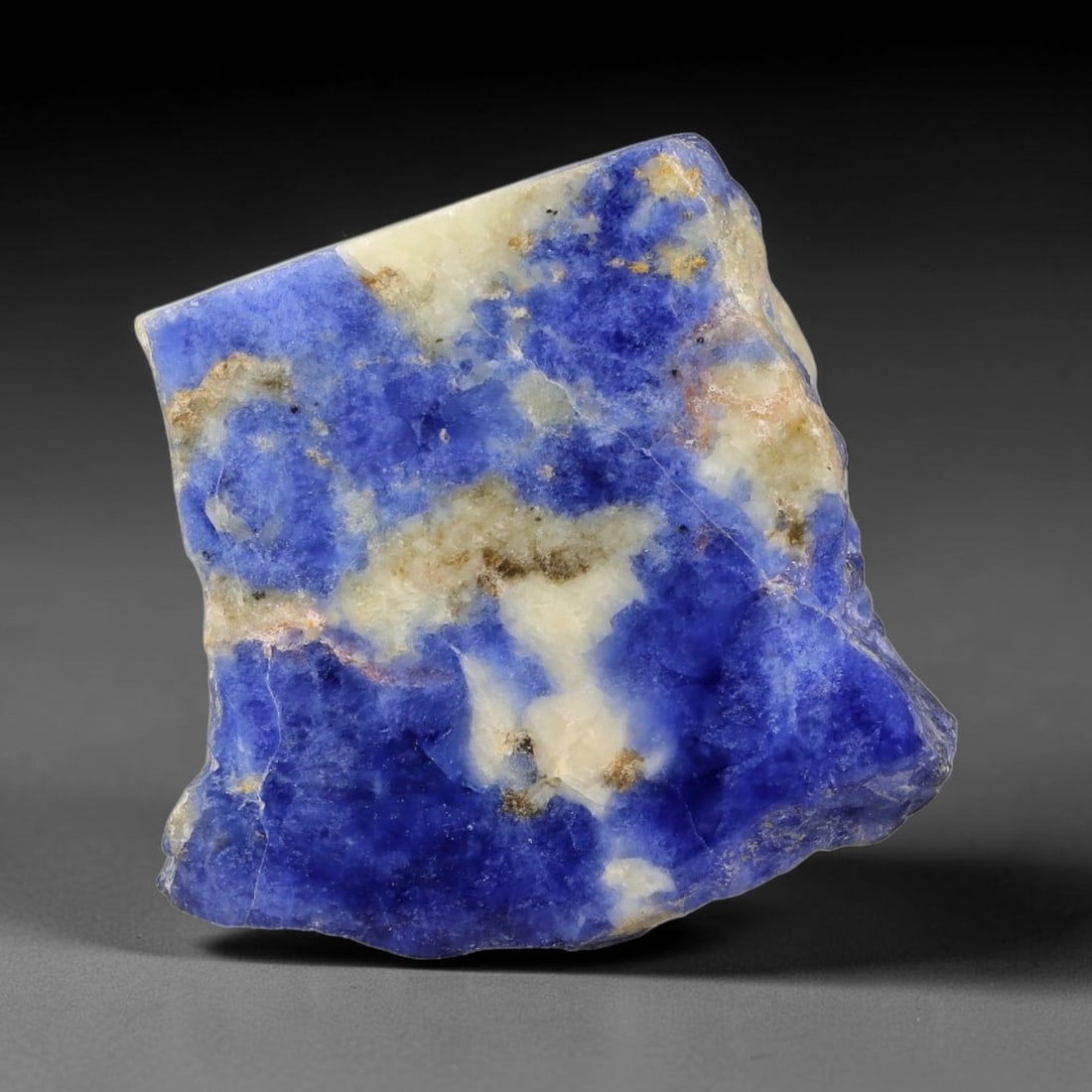 145.07 Carats Natural White Matrix Blue Sodalite Sliced Rough Stone, 68YR: This genuine natural sodalite sliced rough features rich deep blue mineral matrix interspersed with pale creamy white crystalline formations formed through igneous geological processes. Fine natural o