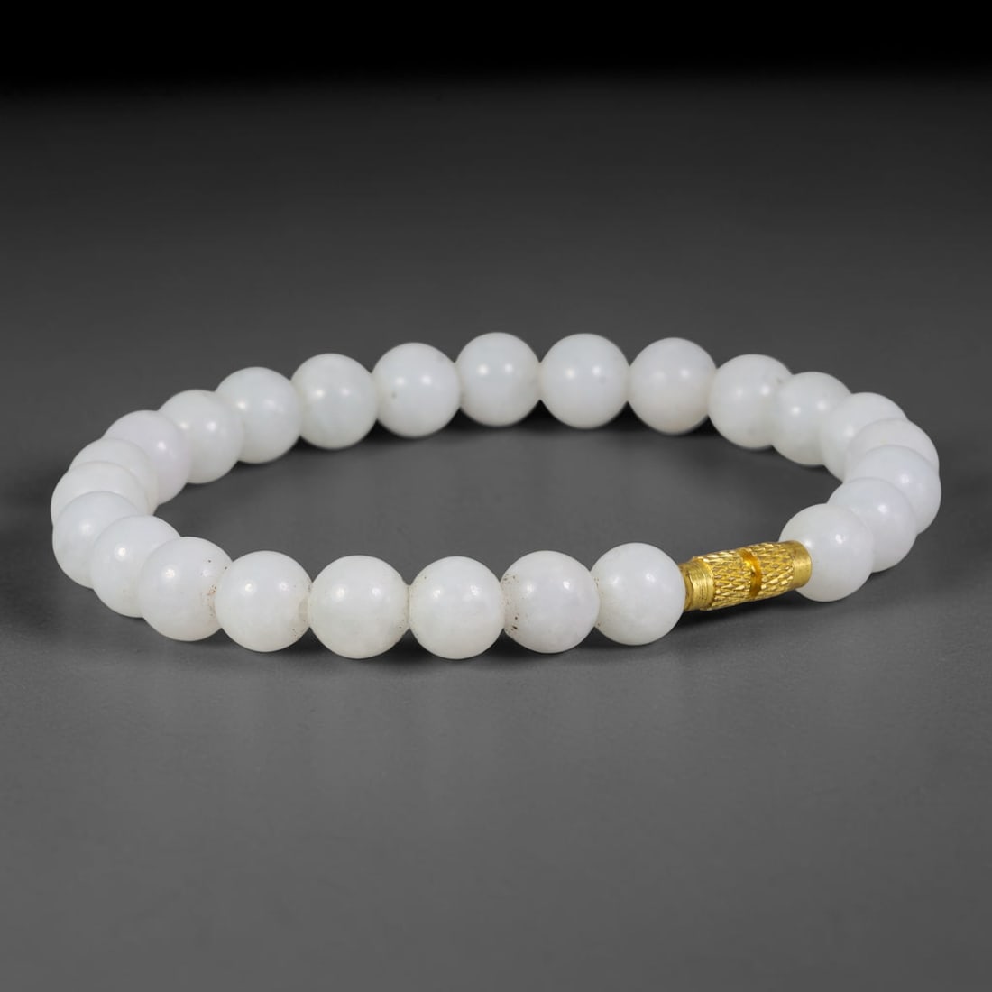 Natural Burmese Type A Pure White Jadeite Jade Bracelet with Gold Decorative Bead, 50TA: Crafted from untreated natural Burmese Type A jadeite jade beads with maximum bead dimension of 7.75mm, this single loop bracelet features smooth polished pure white jadeite beads paired with a textur