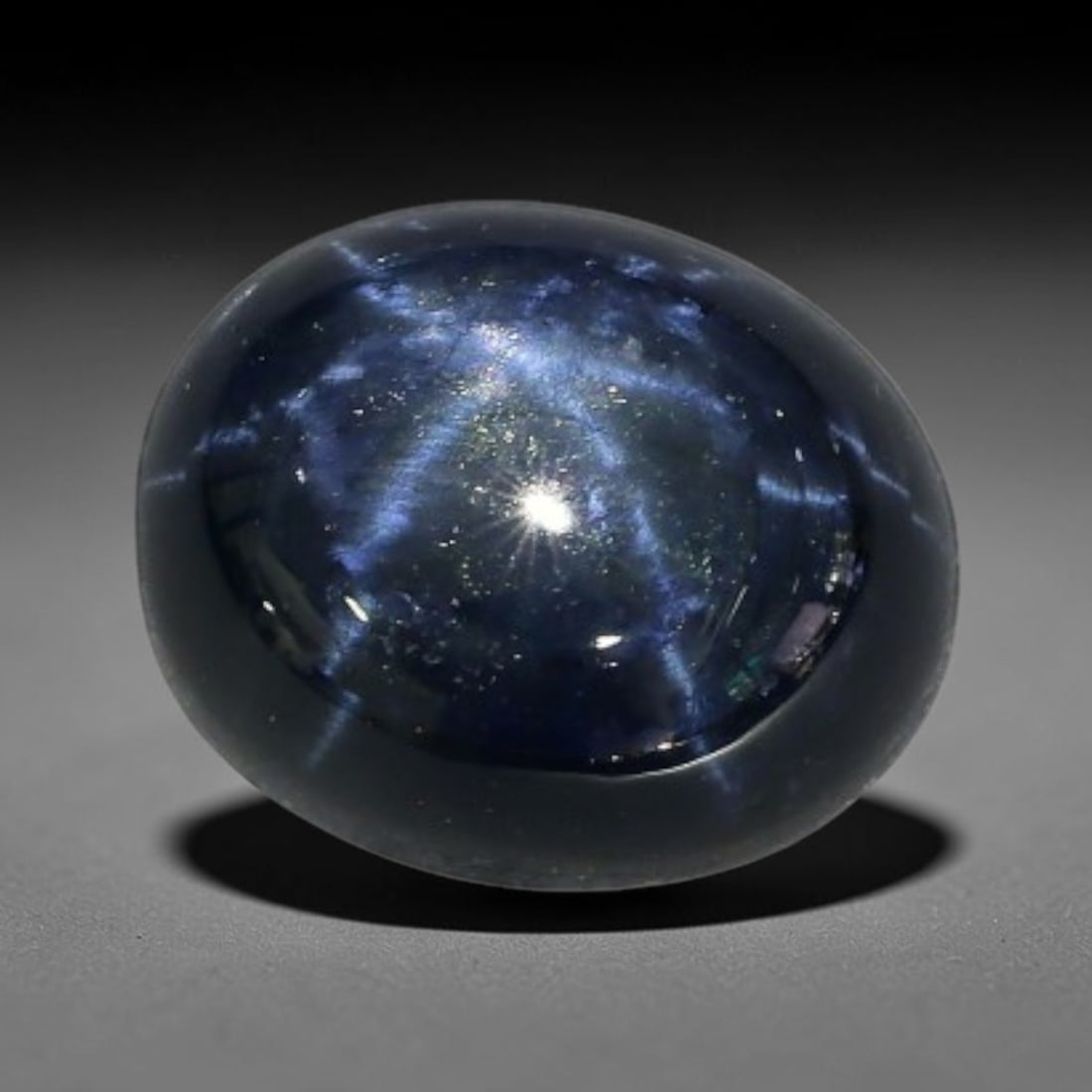 3.40 Carats Natural 6 Ray Blue Star Sapphire Loose Gemstone, 55XX: This star sapphire is crafted from natural corundum deposits and refined into a sleek polished cabochon form through professional lapidary finishing procedures. The distinct six-ray star asterism disp
