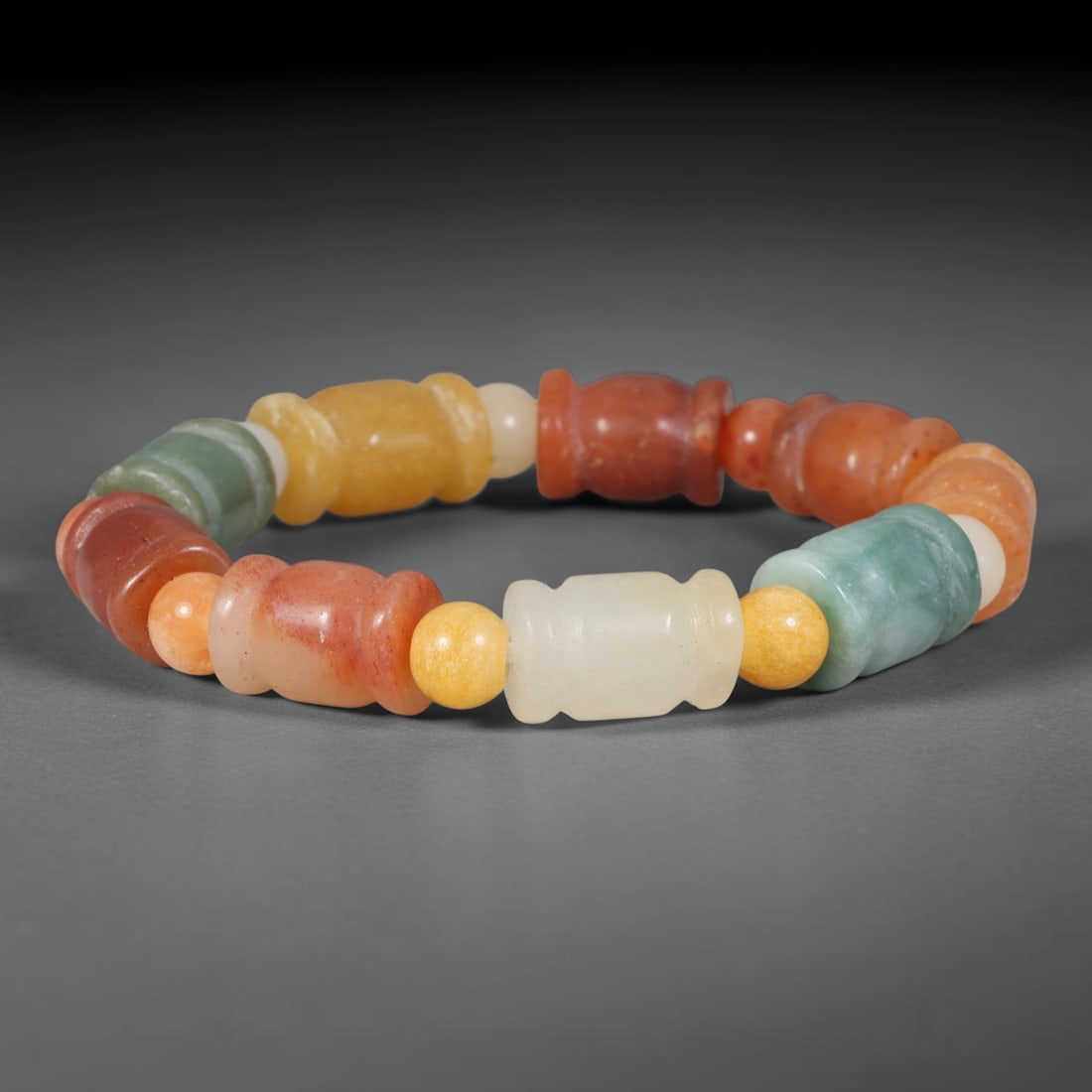 Natural Burmese Type A Multi-Tone Jadeite Jade Barrel Beaded Bracelet, 5TA: Crafted from untreated natural Burmese Type A jadeite jade beads with maximum bead dimension of 11.33mm, this wearable strand features a gentle polished finish displaying layered natural earthy minera