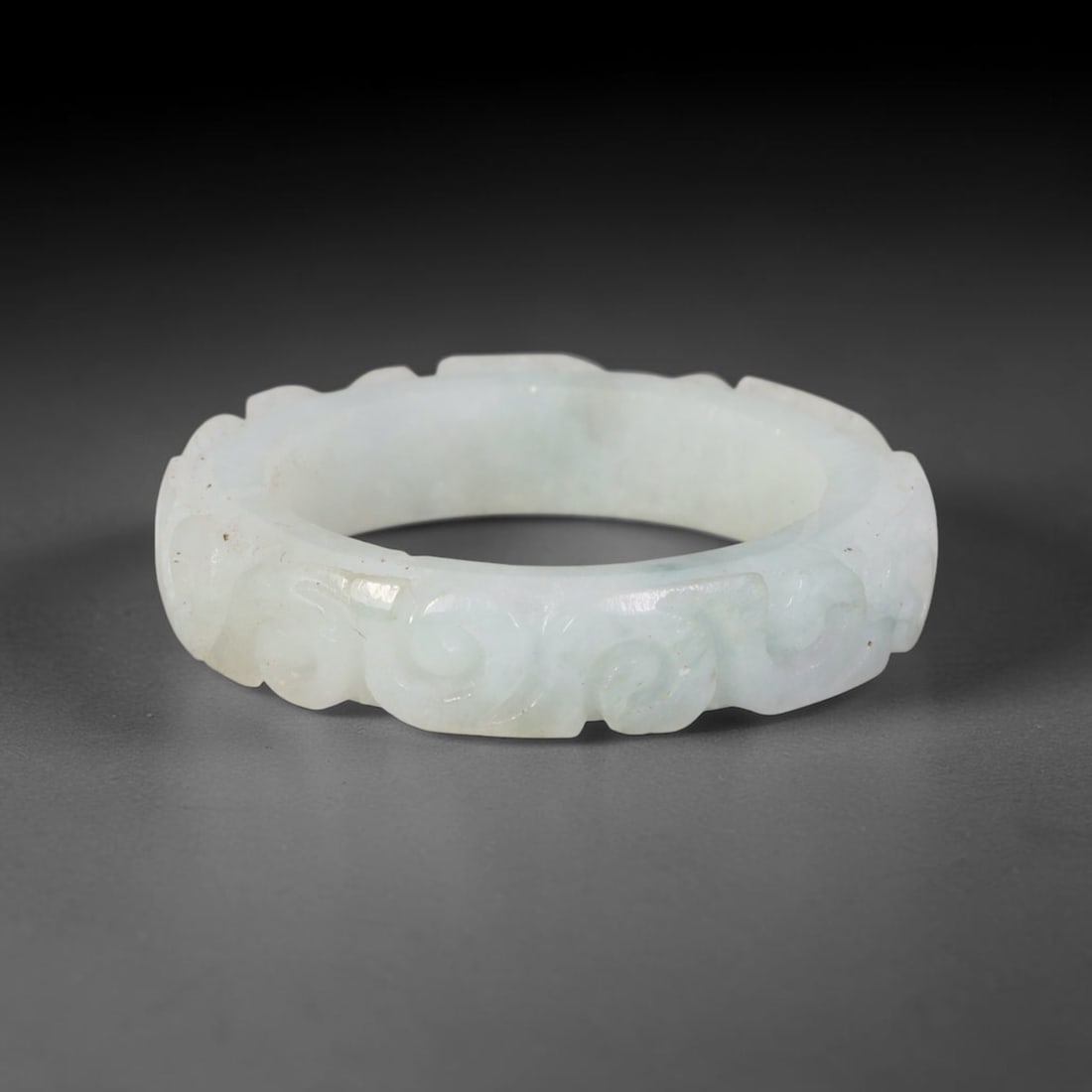 Natural Burmese Type A Jadeite Jade Carving Band Ring Size US 11, 23TB: Carved from untreated natural Burmese Type A jadeite jade, this carved stone band holds a soft polished finish showcasing milky pale base hues interspersed with warm natural brown mineral patina patch
