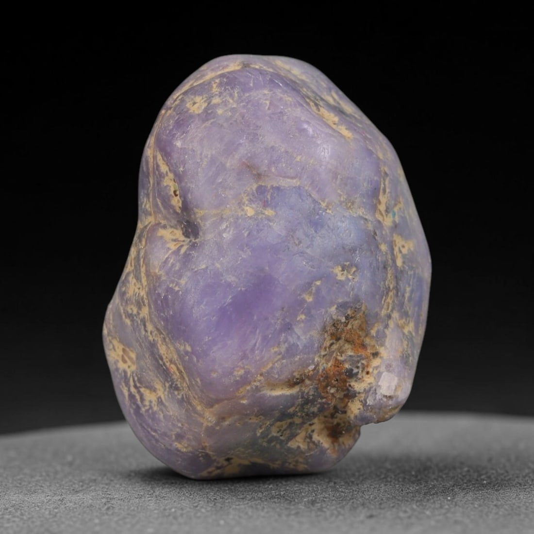 45ct Natural Unheated Sri Lankan Purplish Blue Sapphire Rough, 81YQ: This natural corundum rough is an unheated purplish blue sapphire sourced from Sri Lankan alluvial gem deposits, featuring an irregular natural native form with residual pale yellow-brown mineral matr
