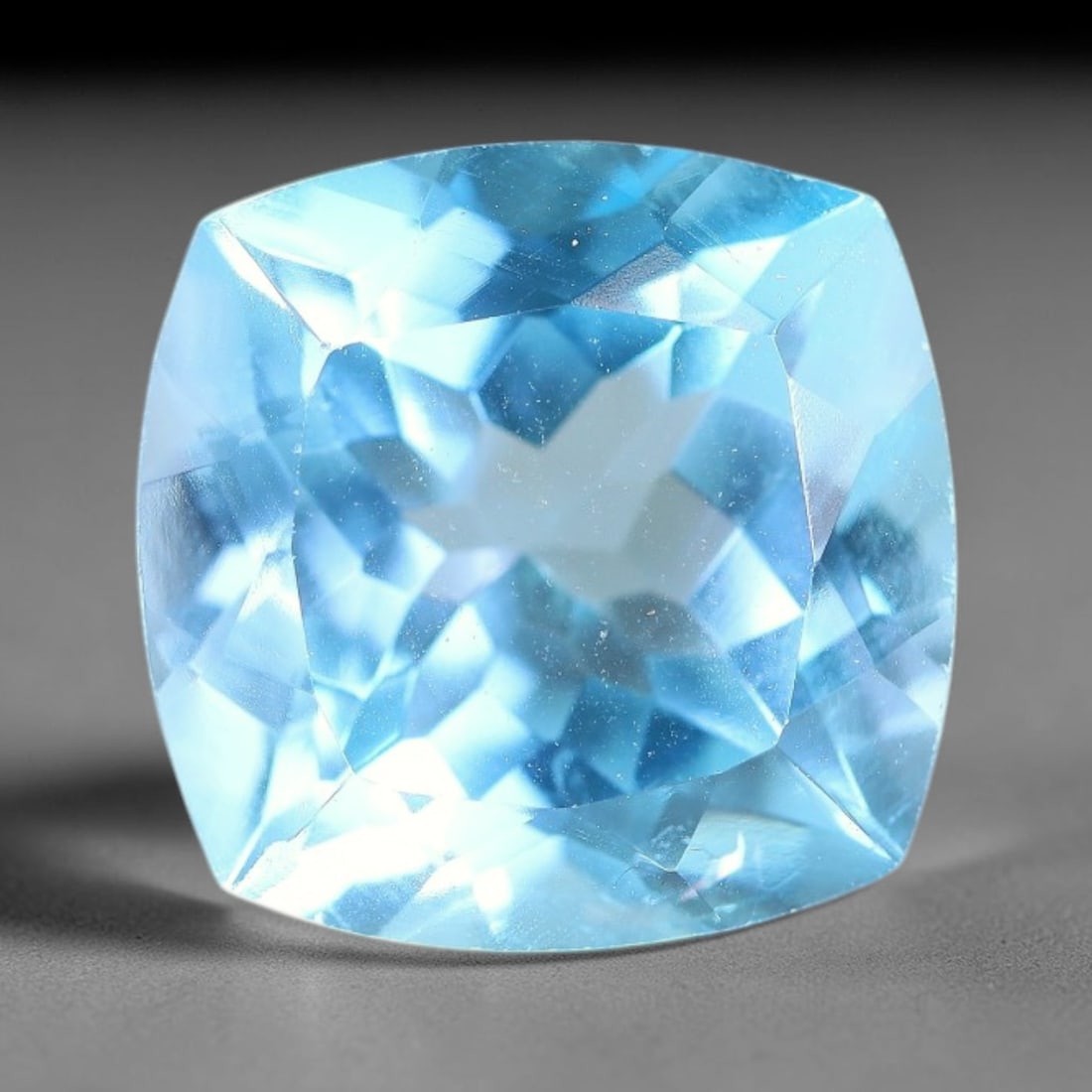 14.40 Carats Natural Brazilian Sky Blue Topaz Cushion Faceted Loose Gemstone, 37XY: Constructed from genuine natural topaz sourced from Brazilian mineral deposits, the raw material has been refined through professional faceted lapidary processing with consistent glossy polishing acro
