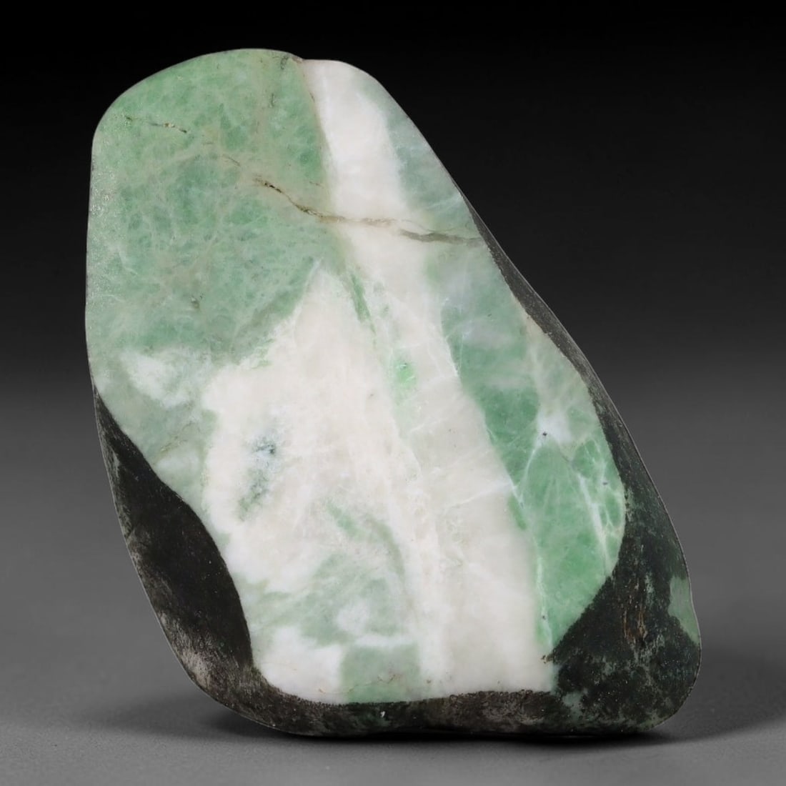 140ct Natural Type A Burmese Jadeite Jade Sliced Rough, 74YN: This specimen is a sliced rough block of natural Type A Burmese jadeite jade. The interior displays natural colour zoning with visible mineral veining and crystalline patterns typical of unprocessed j