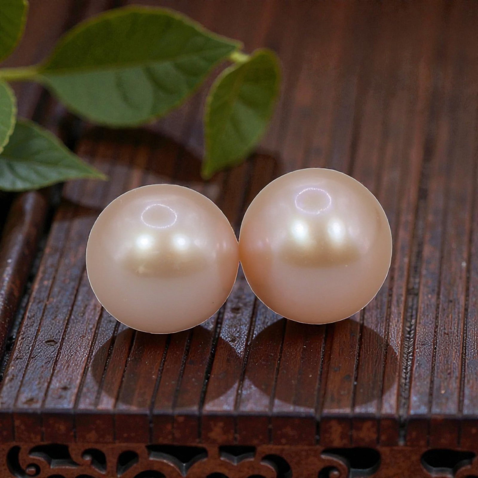 Freshwater Pearl Pair - Natural Pearl Peach Round Gemstones 8mm, 44XA: A matched pair of natural freshwater pearls, exhibiting a soft peach-pink hue with bright, uniform luster and subtle iridescent orient. The pearls are near-spherical, with smooth nacre and only minor 