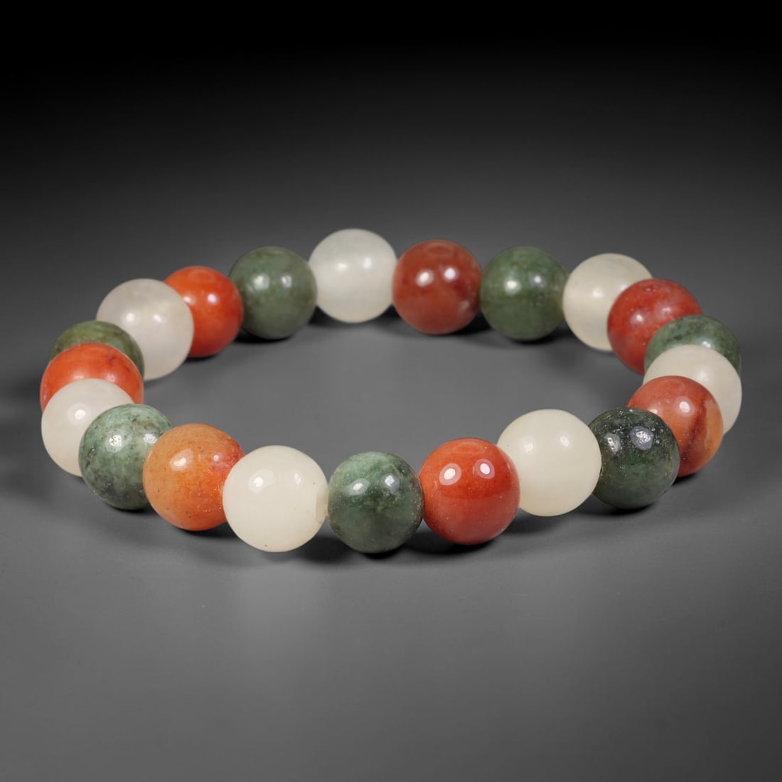 Natural Burmese Type A Multi-Colour Jadeite Jade Beaded Bracelet, 71TA: Strung from untreated natural Burmese Type A jadeite jade spherical beads with maximum bead dimension of 10.73mm, this bracelet strand features a sleek smooth polished finish showcasing mixed pale gre