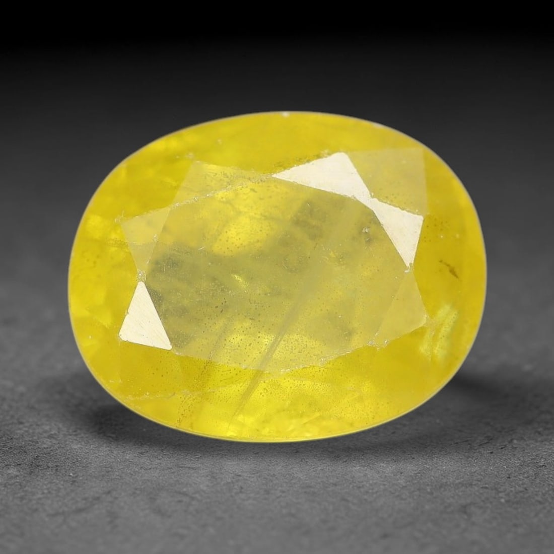 3.83 Carats Natural Yellow Sapphire Oval Faceted Loose Gemstone, 60XM: This natural yellow sapphire features a classic oval brilliant faceted cut, holding consistent warm golden-yellow color throughout the corundum crystal. Fine microscopic mineral specks and faint natur