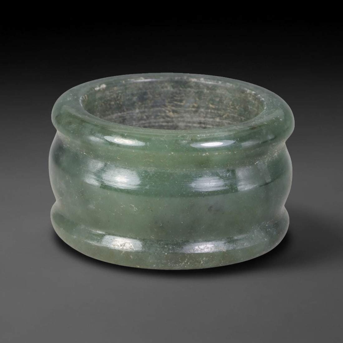 Natural Burmese Type A Jadeite Jade Band Ring Size US 9.50, 6TB: Fashioned from untreated natural Burmese Type A jadeite jade, this solid stone band carries a smooth polished finish showcasing milky pale base tones blended with soft natural green mineral undertones