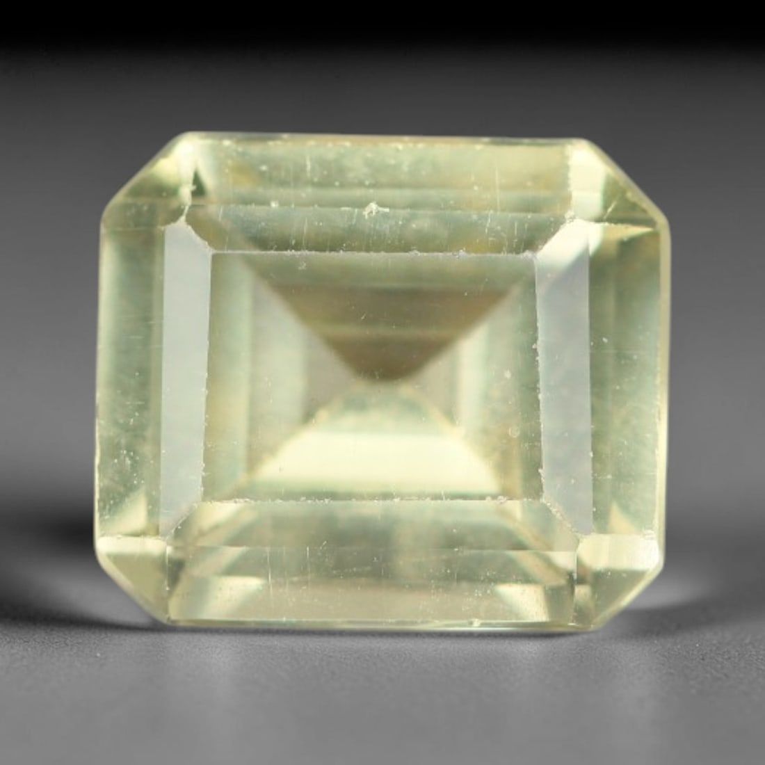 1.77 Carats Natural Pale Yellow Apatite Faceted Loose Gemstone, 40XY: This apatite specimen is sourced from natural geological deposits and shaped with professional faceting and high-gloss polishing work across the outer facet surfaces. Minute internal mineral inclusion