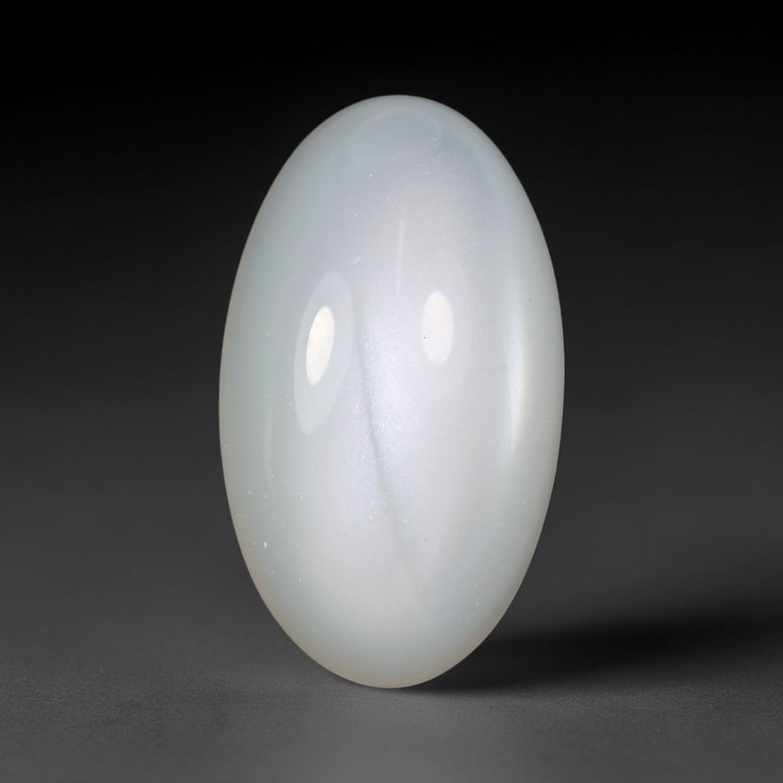16.85 Carats Natural Ceylon White Moonstone Loose Gemstone, 43WJ: This natural Ceylon white moonstone holds dimensions of 23.6x13.6x7.3mm, a well-polished natural feldspar gemstone sourced from Ceylon's renowned moonstone mineral deposits famous for distinctive ligh