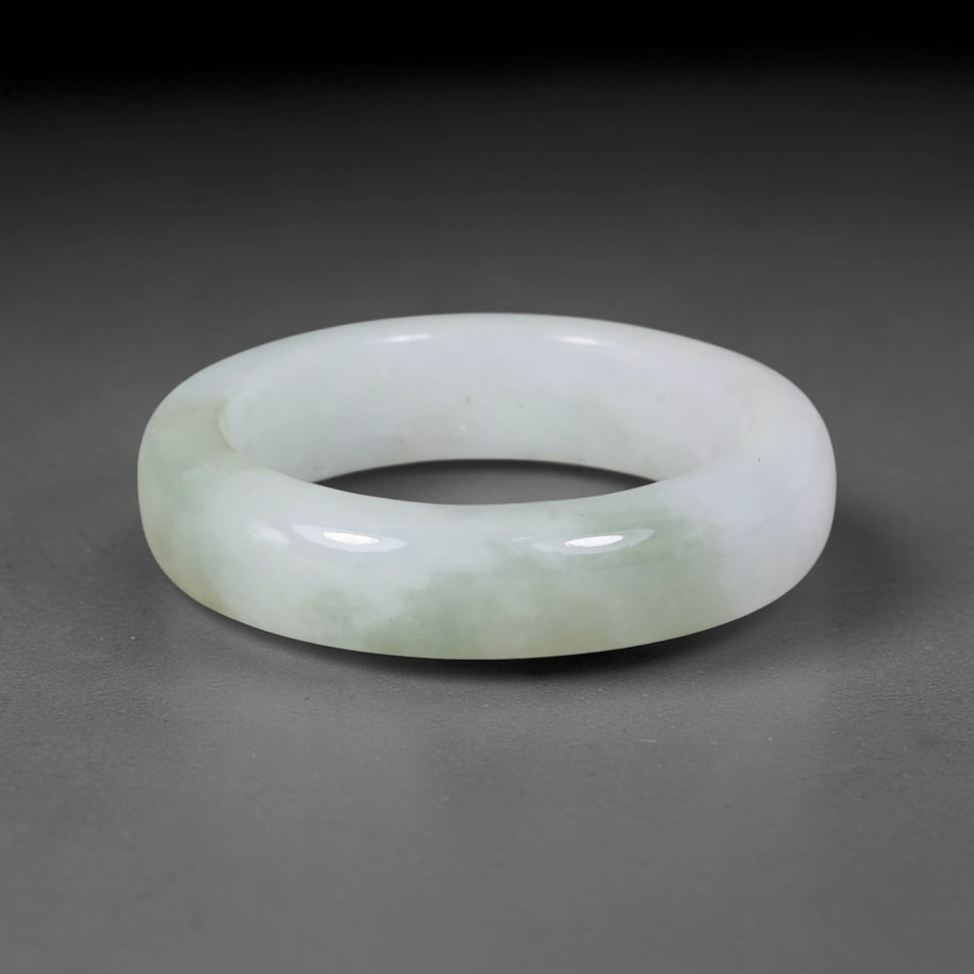 Natural Burmese Type A Jadeite Jade Band Ring Size US 12, 39TB: Crafted from untreated natural Burmese Type A jadeite jade, this solid stone band features a high-gloss polished finish displaying consistent deep green mineral tones interwoven with natural subtle to