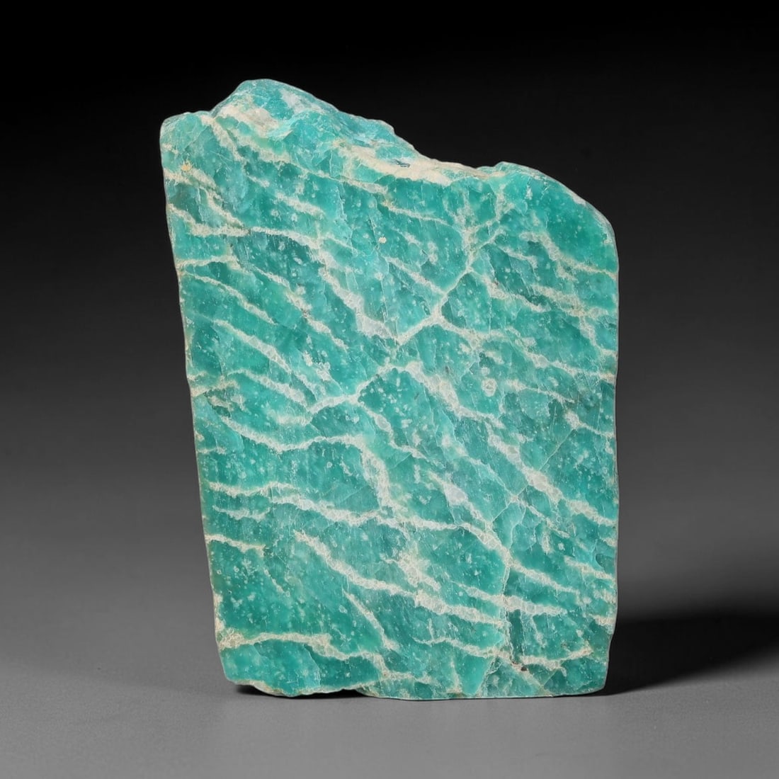 86ct Natural Russian Ural Amazonite Slab Rough, 55WV: This intact amazonite slab features distinct parallel mineral banding running uniformly across its naturally split flat surface within 42x30x6mm slab dimensions, retaining unmodified natural geologica