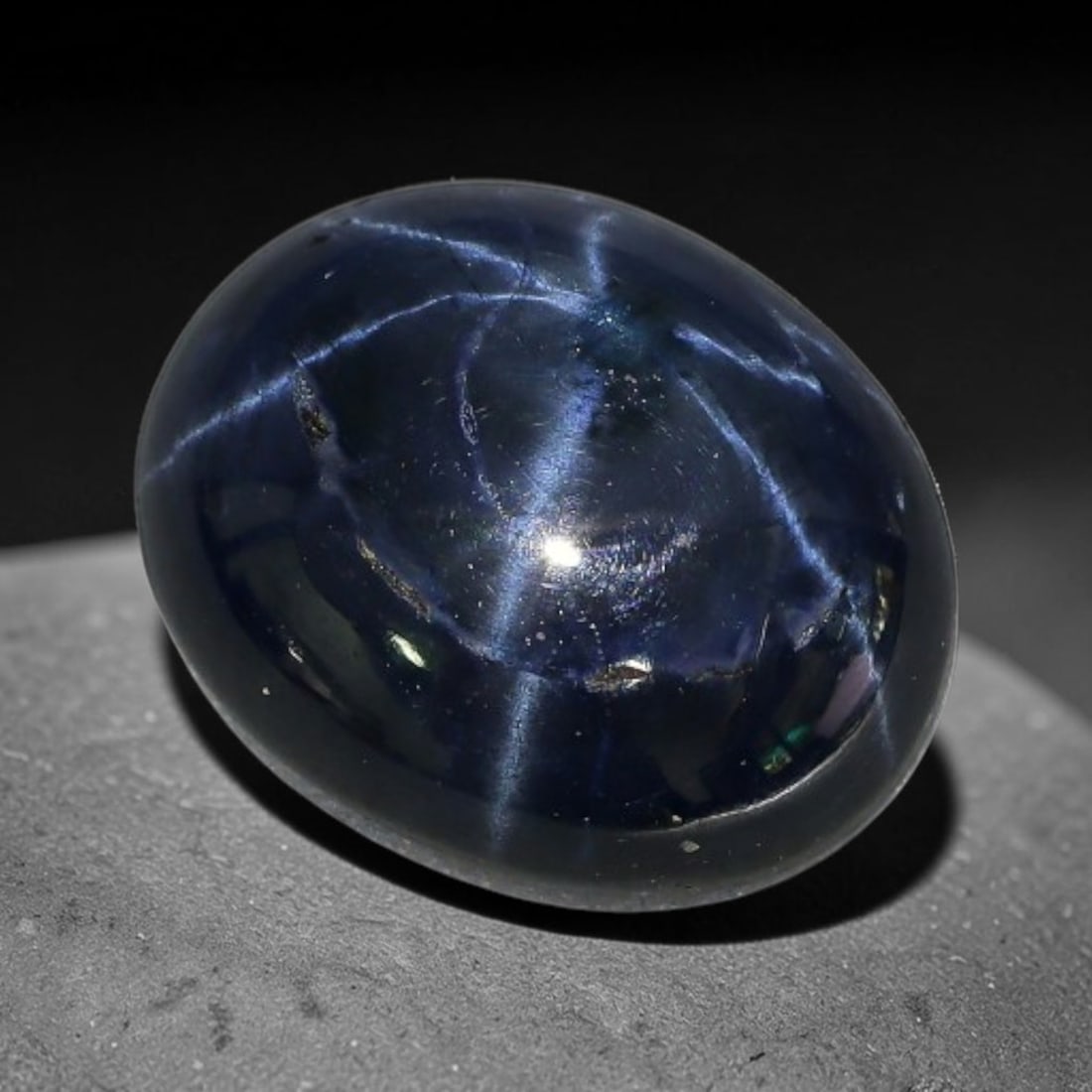 6.00 Carats Natural 6 Ray Blue Star Sapphire Loose Gemstone, 50XX: This star sapphire is crafted from natural corundum deposits and refined into a sleek polished cabochon form through professional lapidary finishing procedures. The distinct six-ray star asterism disp