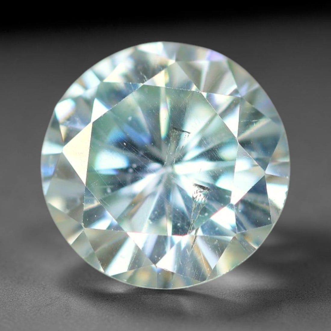 0.93 Carats Aqua Toned Moissanite Loose Gemstone, 70WP: This moissanite features dimensional measurements of 6.5x3.6mm, lab-grown silicon carbide material valued for superior light refraction that delivers vivid multi-hued sparkle across all lighting condi