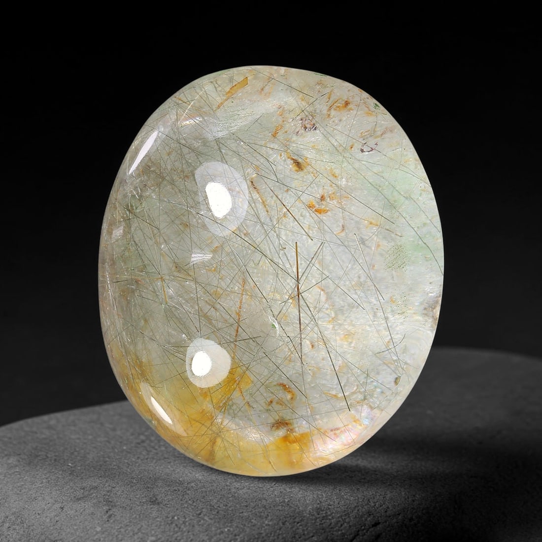 25.67ct Natural Brazilian Black Rutile Quartz Cabochon Loose Gemstone, 17YX: This polished cabochon of natural rutile quartz features countless distinct slender black rutile needle inclusions suspended within the clear quartz host crystal. The smooth domed surface enables full