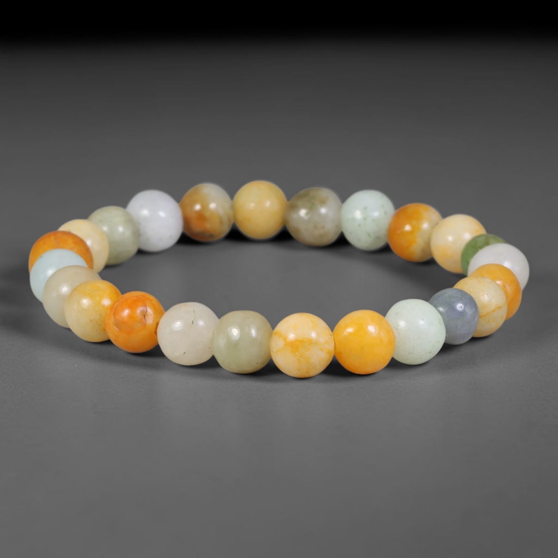 Natural Burmese Type A Multi-Colour Jadeite Jade Beaded Bracelet, 45TA: Strung from untreated natural Burmese Type A jadeite jade spherical beads with maximum bead dimension of 8.40mm, this bracelet strand features a sleek smooth polished finish showcasing mixed pale gree