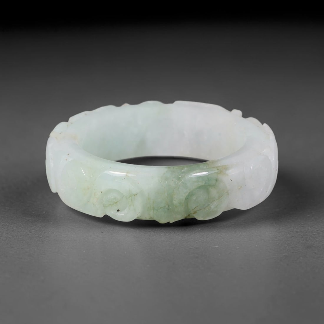 Natural Burmese Type A Jadeite Jade Carving Band Ring Size US 10.5, 15TB: Carved from untreated natural Burmese Type A jadeite jade, this carved stone band holds a soft polished finish showcasing milky pale base hues interspersed with warm natural brown mineral patina patch