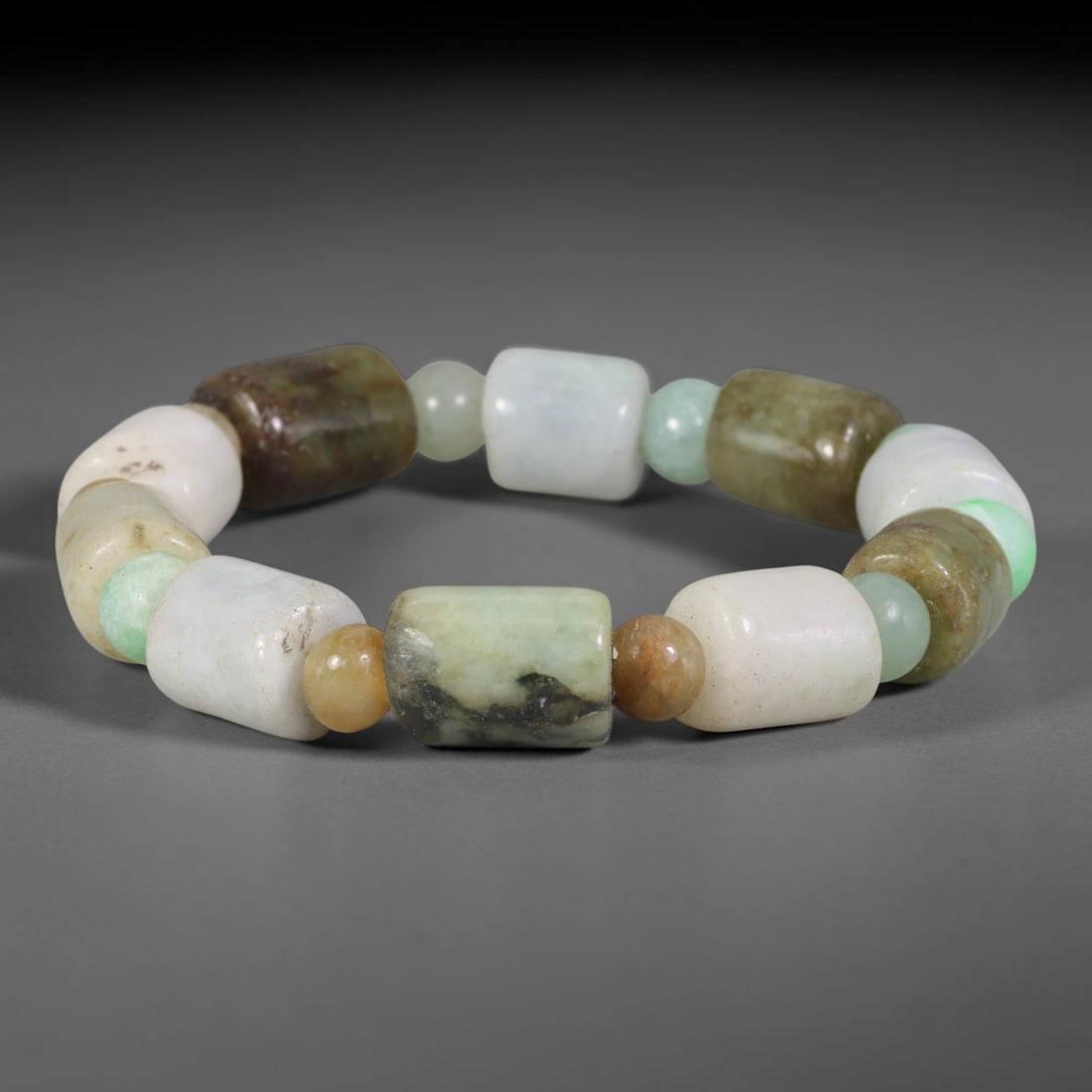 Natural Burmese Type A Multi-Tone Jadeite Jade Beaded Bracelet, 10TA: Crafted from untreated natural Burmese Type A jadeite jade beads with maximum bead dimension of 11.08mm, this wearable strand features a gentle polished finish displaying layered mixed natural mineral