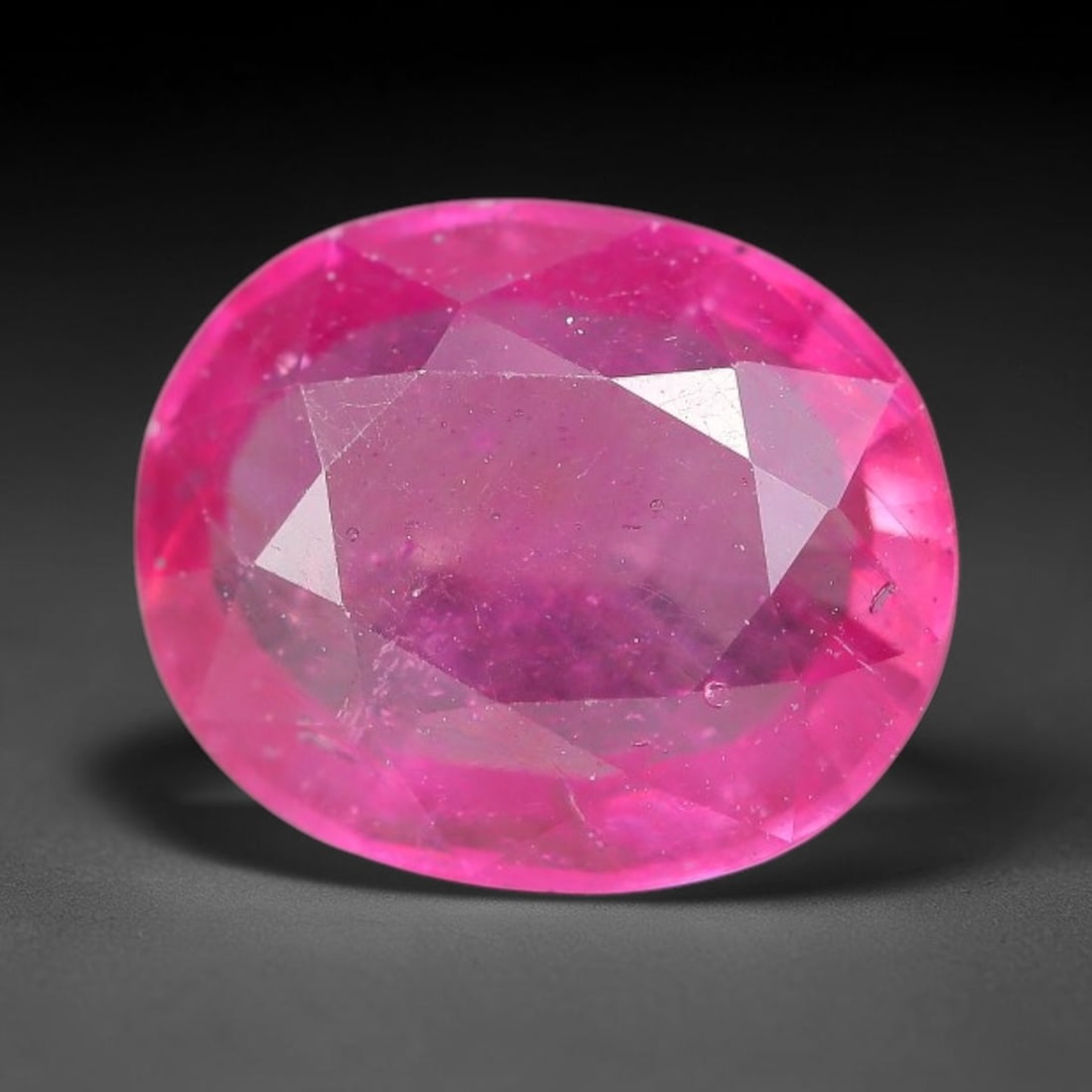 4.32 Carats Natural Mozambique Ruby Oval Faceted Loose Gemstone, 96WY: This natural Mozambique ruby is fashioned with standard oval brilliant faceting, displaying vivid saturated crimson-red hue accompanied by native fine mineral inclusions and subtle trace marks inheren