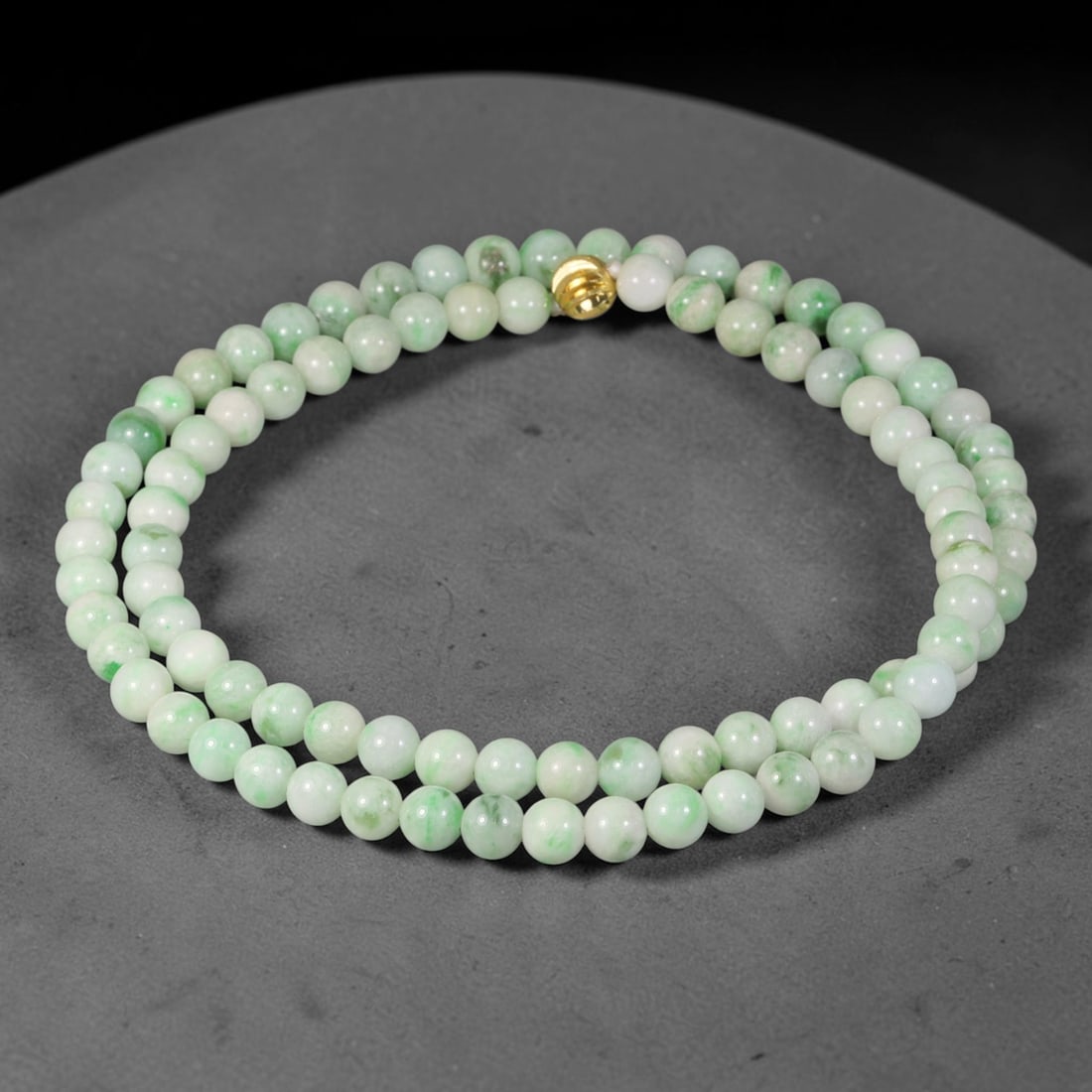 Natural Burmese Type A Pale White Base Floating Green Round Jadeite Jade Beaded Necklace, 48TF: Hand-strung bead necklace made of genuine untreated Type A Burmese jadeite round beads, featuring a clean pale white base with soft scattered floating green flecks. Equipped with a polished gold-toned