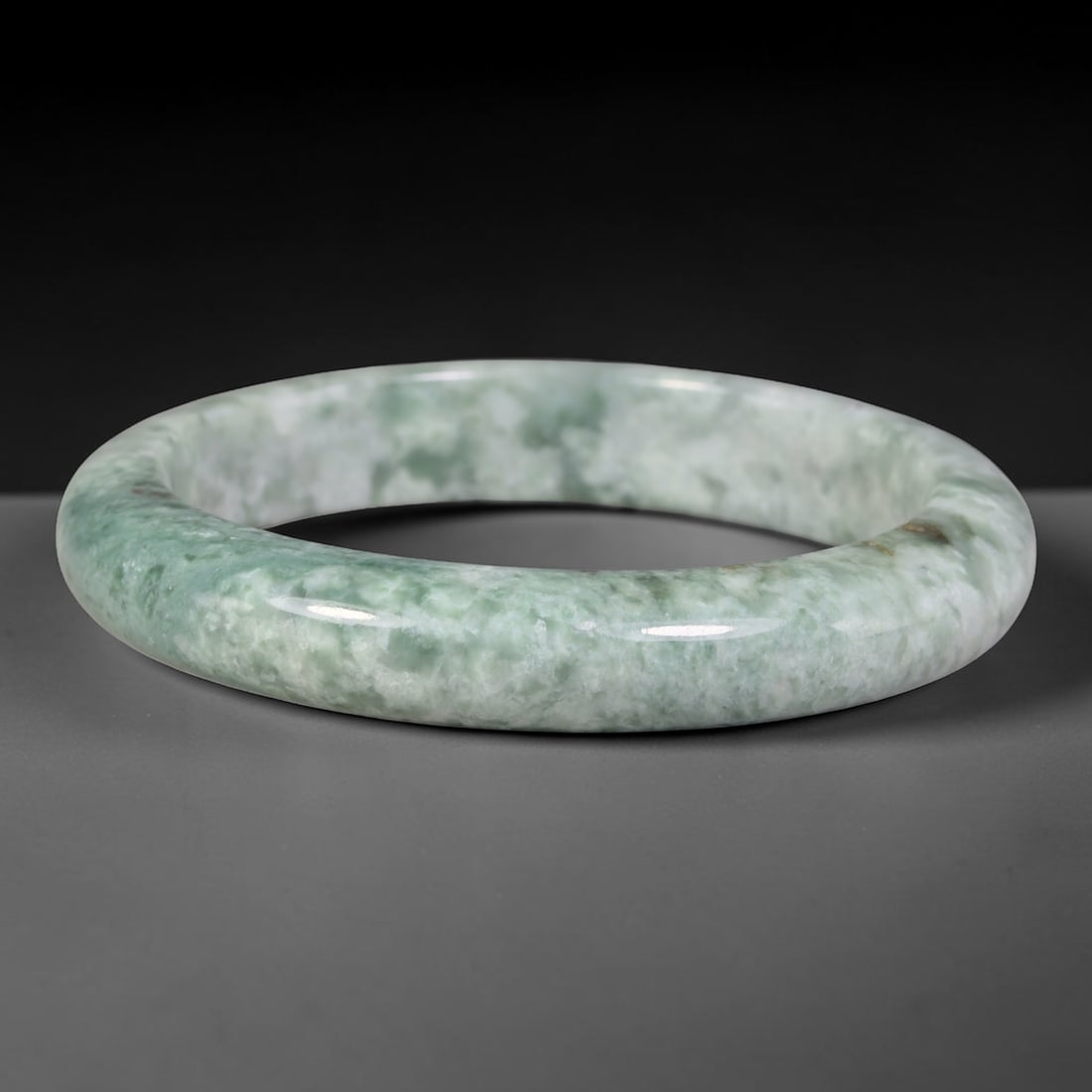 Natural Burmese Type A Variegated Floating Cloud Green Jadeite Jade Bangle Bracelet, 81TD: Genuine natural Burmese Type A jadeite jade bangle, featuring soft floating cloud green mottling across a pale milky base. Smooth polished solid band, inner dimension 58.8x11.4mm. Natural stone variat