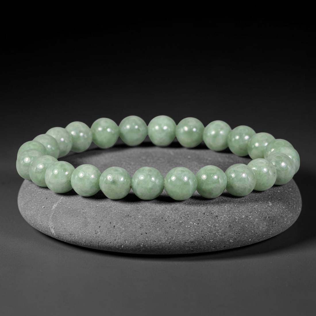 Natural Burmese Type A Soft Pale Mint Green Jadeite Jade Bead Bracelet, 36TP: Strung from natural Type A Burmese jadeite, this spherical bead bracelet features a clean soft pale mint green tone with faint subtle natural clouding throughout the beads. Each bead is smoothly polis