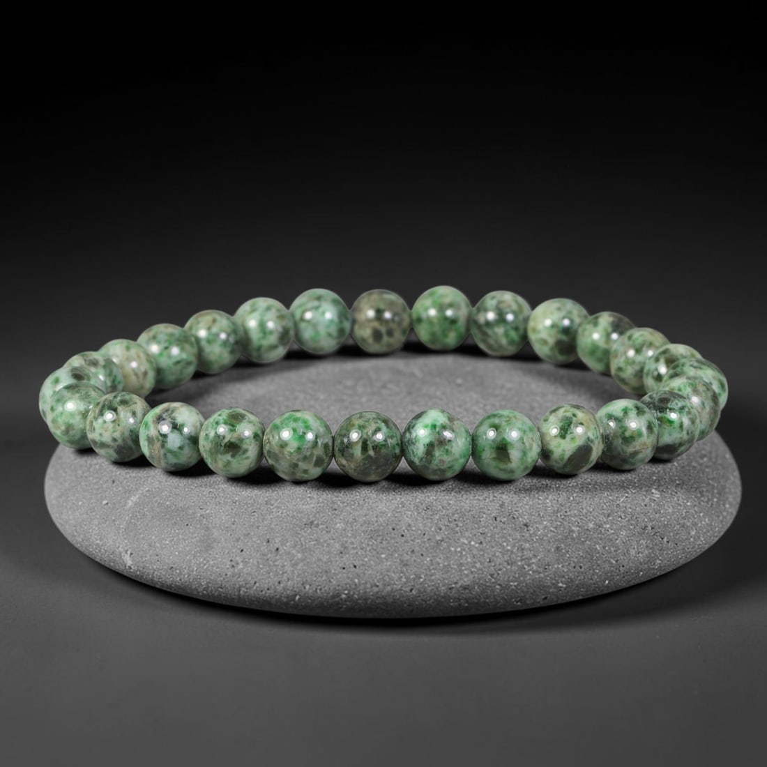 Natural Burmese Type A Deep Moss Spotted Jadeite Jade Bead Bracelet, 41TP: Strung from natural Type A Burmese jadeite, this spherical bead bracelet features an earthy pale base interspersed with dense deep moss-green speckling and mottling throughout each bead. Every bead is