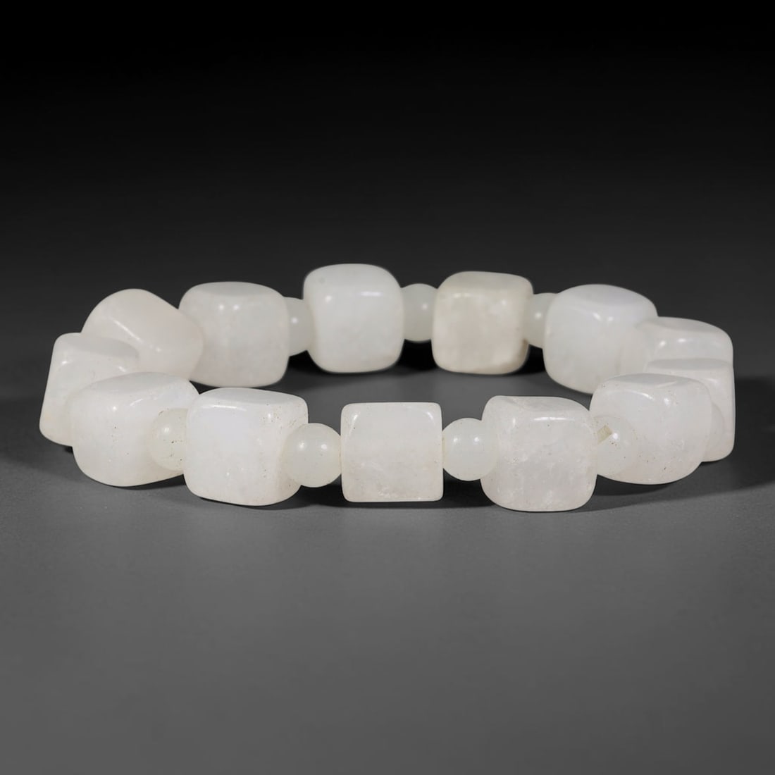 Natural Burmese Type A Milky White Cube Jadeite Jade Beaded Bracelet, 52TP: Polished elastic strand bracelet hand-strung with genuine untreated Type A Burmese jadeite cube beads in soft milky white, accented by small smooth round jadeite spacer beads. Subtle natural fine mine