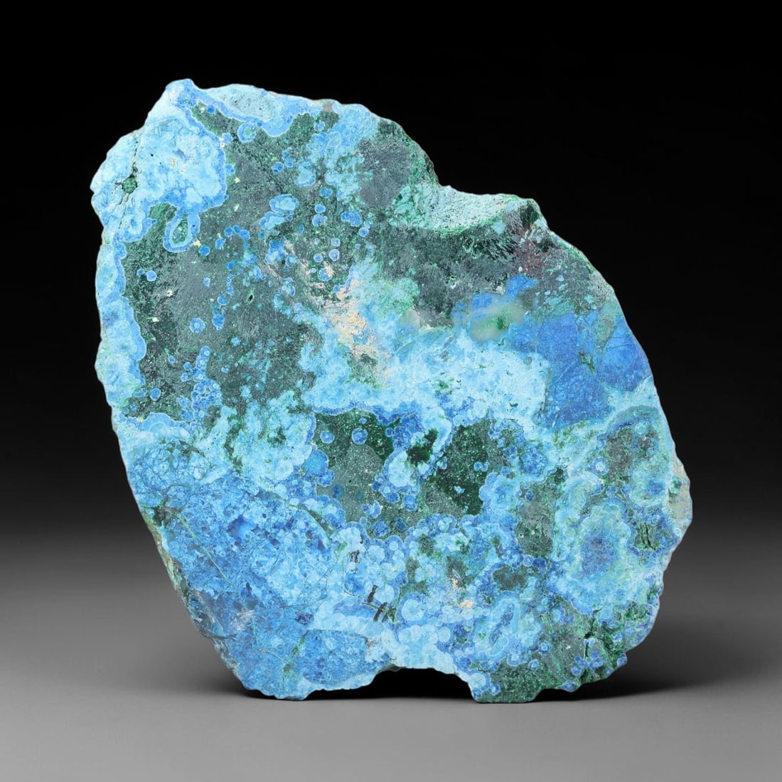272ct Natural Peruvian Chrysocolla Polished Slab Rough, 92YS: This partial-polished chrysocolla slab features blended mineral matrix with smooth refined face and unaltered natural rugged edge across its 62x44x19mm elongated form, translucent mineral layers hold 