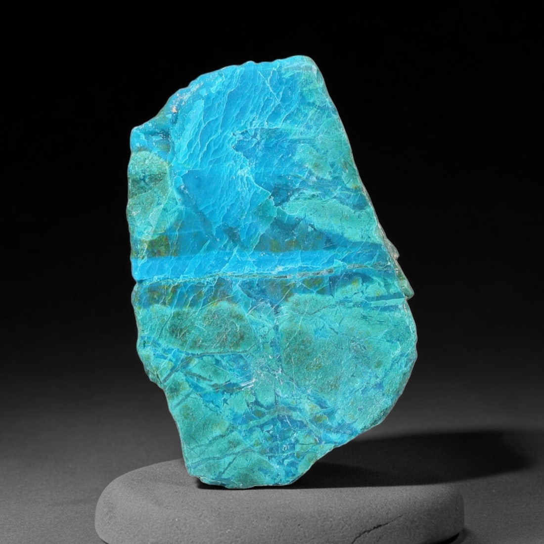 63ct Natural Peruvian Chrysocolla Polished Slab Rough, 89YS: This partial-polished chrysocolla slab features blended mineral matrix with smooth refined face and unaltered natural rugged edge across its 32x21x11mm elongated form, translucent mineral layers hold 