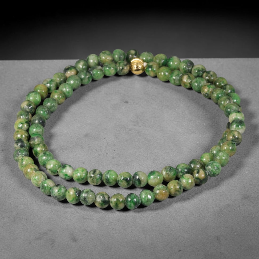 Natural Burmese Type A Dark Mottled Green Round Jadeite Jade Beaded Necklace, 41TF: Hand-strung bead necklace crafted from genuine untreated Type A Burmese jadeite round beads in rich mottled forest green with natural lighter and deeper green speckling throughout. Fitted with a polis