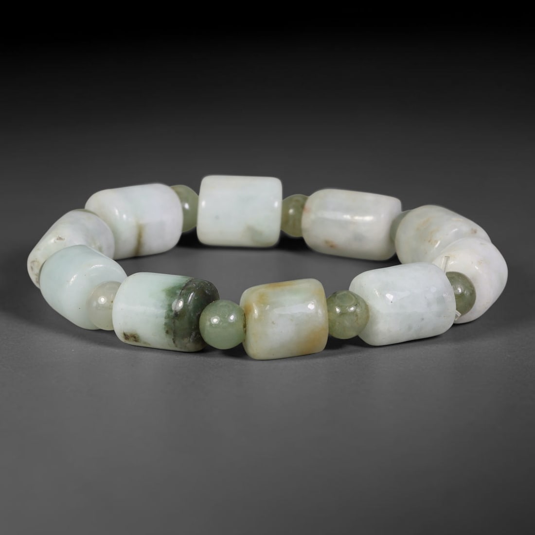 Natural Burmese Type A Multi-Tone Jadeite Jade Beaded Bracelet, 3TA: Crafted from untreated natural Burmese Type A jadeite jade beads with maximum bead dimension of 10.70mm, this wearable strand features a gentle polished finish displaying layered mixed natural mineral