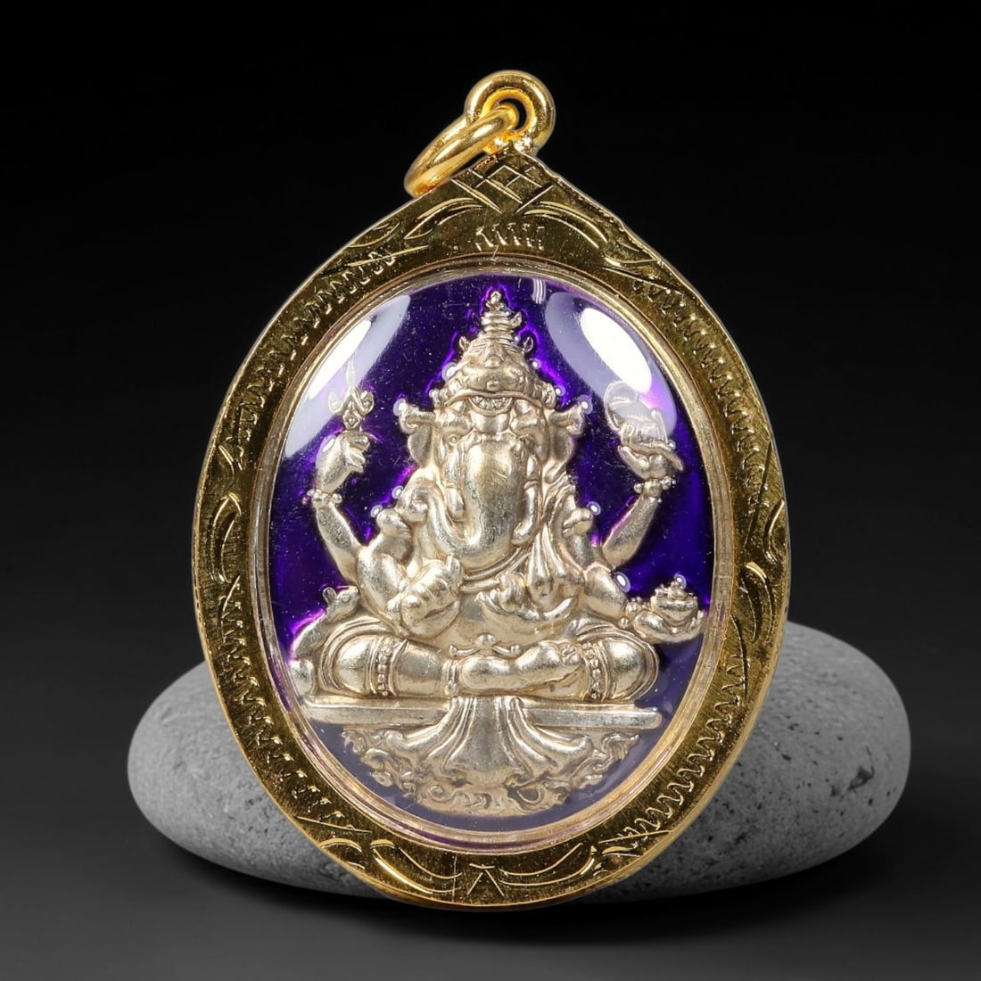 Thai Ganesha Elephant God Dual-Sided Gold Plated Metal Casing Amulet, 35YY: Teardrop-shaped Thai Ganesha god amulet with silver metal core sealed under clear transparent cover, housed inside hand-engraved gold-plated metal casing fitted with matching gold-toned metal loop. Si