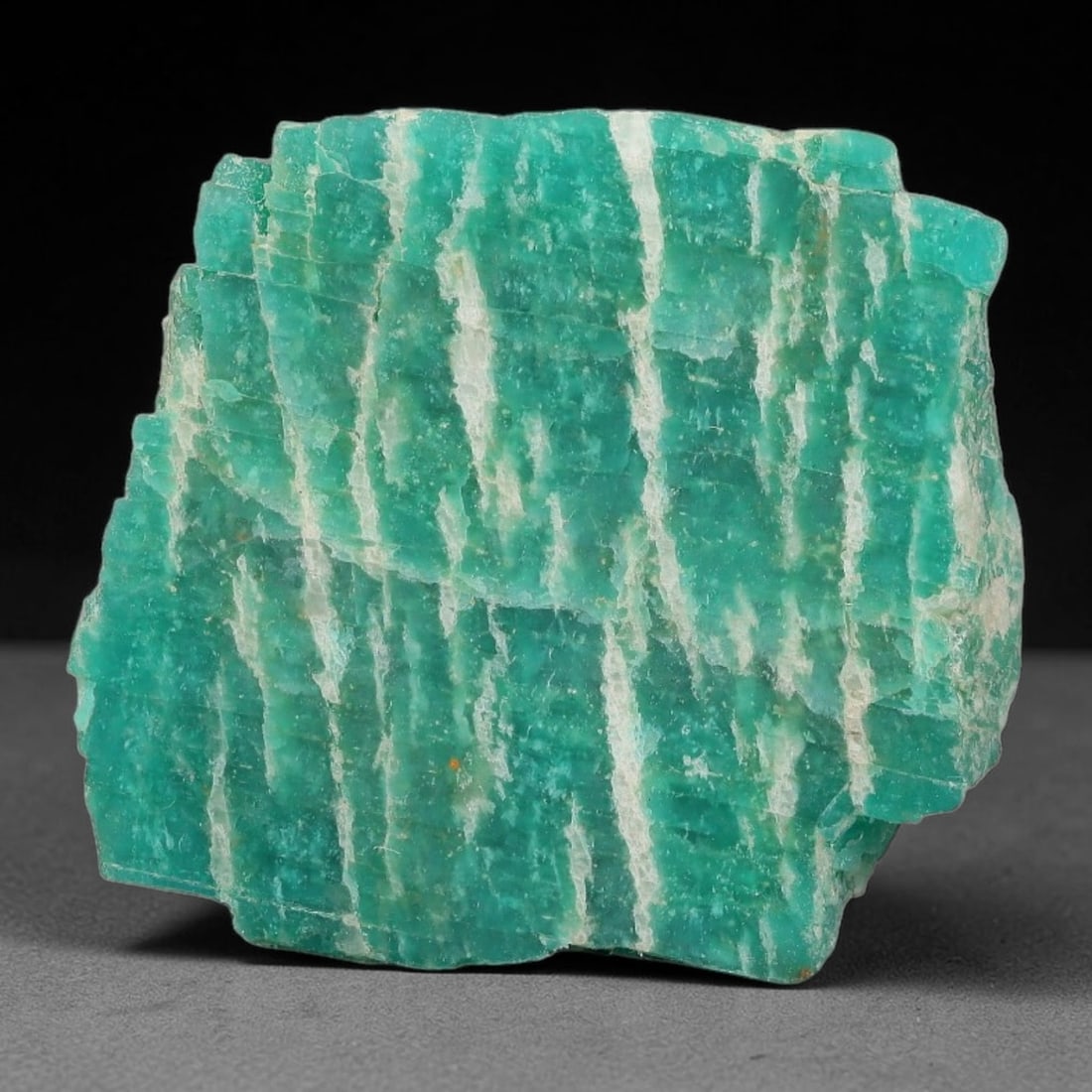 68ct Natural Russian Ural Amazonite Slab Rough, 20WV: This intact amazonite slab features distinct parallel mineral banding running uniformly across its naturally split flat surface within 31x29x7mm slab dimensions, retaining unmodified natural geologica