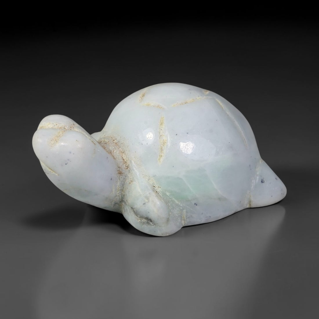 Natural Burmese Type A Pale White Greenish Jadeite Jade Turtle Carving, 97TC: Hand-carved from natural Burmese Type A jadeite, this turtle figurine measures 41x25mm. It features milky pale white base with faint light green undertones, scattered tiny dark speckles and subtle ear