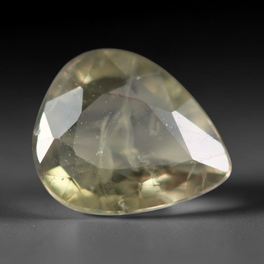 0.78 Carats Natural Pale Honey Yellow Sapphire Loose Faceted Gemstone, 29XM: Natural soft pale honey yellow corundum sapphire expertly faceted loose gemstone, multi-facet cut optimizes light reflection and highlights its delicate translucent warm yellow tone. The crystal matri