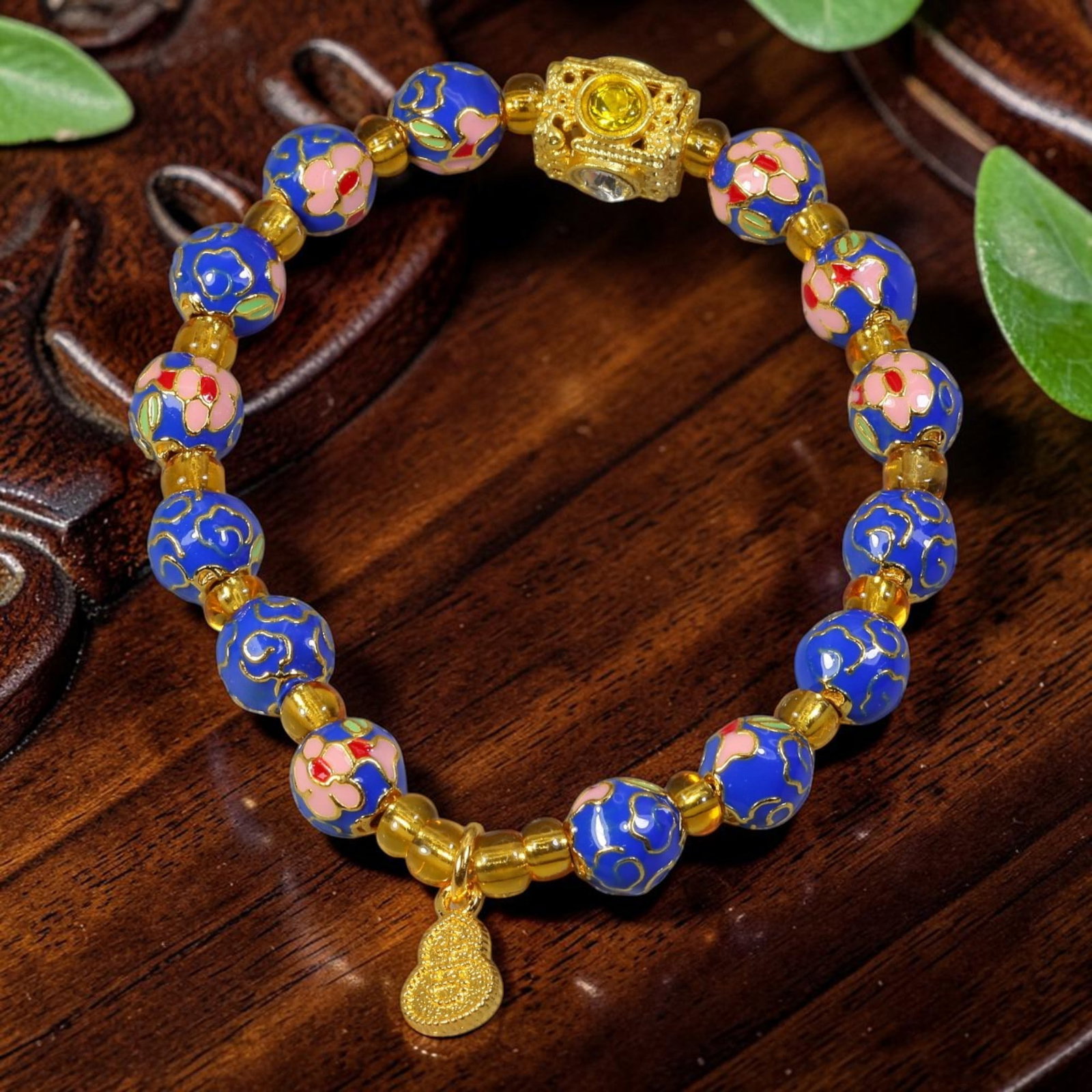 Chinese Cloisonne Enamel Beaded Bracelet - Blue Gold Gourd Prosperity Charm, 86YG: This modern Chinese revival stretch bracelet features round cloisonne enamel beads measuring 7.80 millimeters, finished in rich royal blue enamel detailed with two alternating patterns: raised gold-to