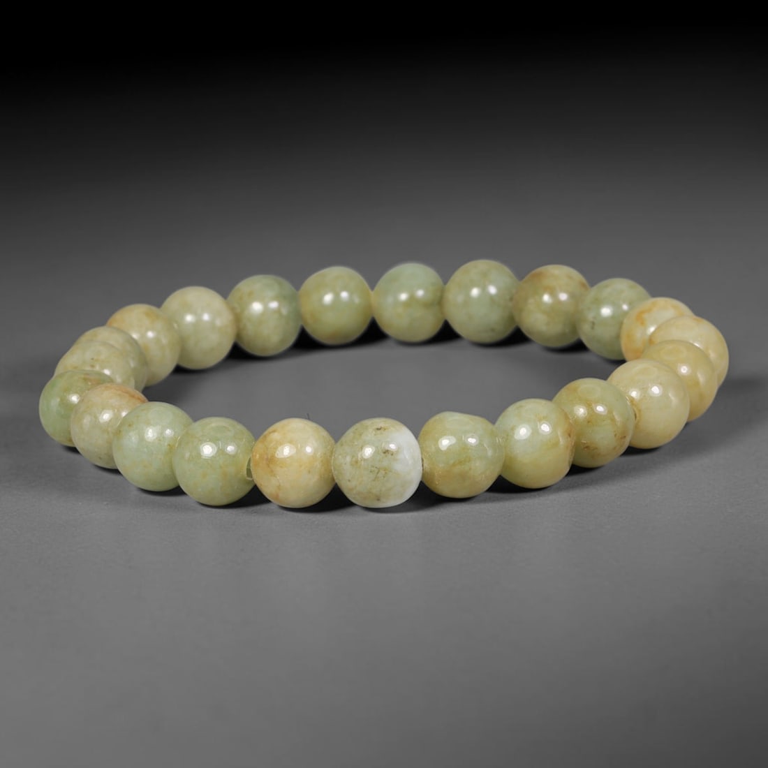 Natural Burmese Type A Pale Yellowish Celadon Jadeite Jade Beaded Bracelet, 85TA: Crafted from fully untreated genuine Burmese Type A jadeite, this bracelet features smoothly polished uniform round beads with a soft pale celadon foundation naturally blended with warm yellow mineral