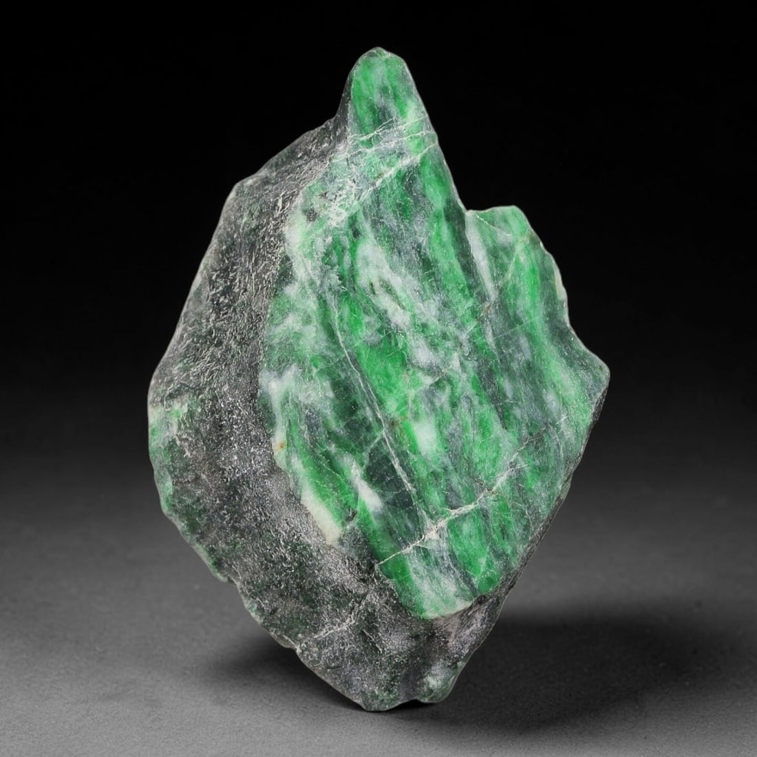 73ct Natural Type A Burmese Jadeite Jade Sliced Rough, 61YN: This specimen is a sliced rough block of natural Type A Burmese jadeite jade. The interior displays natural colour zoning with visible mineral veining and crystalline patterns typical of unprocessed j