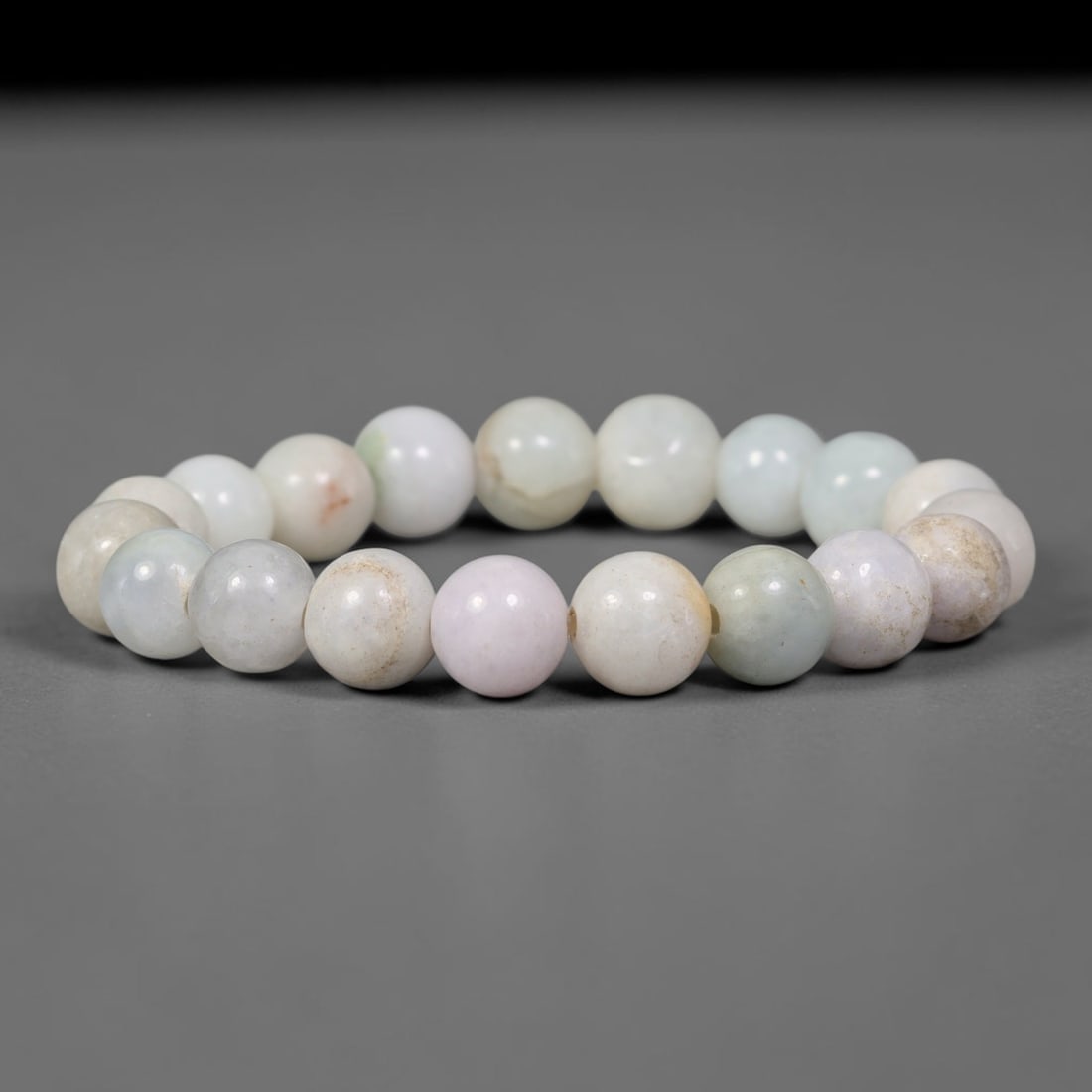 Natural Burmese Type A Jadeite Jade White Round Bead Bracelet, 82TK: Polished from natural Burmese Type A jadeite, this bracelet features smooth round white beads measuring 10.3mm. It presents milky white bases blended with soft pale lavender, faint pale green and subt