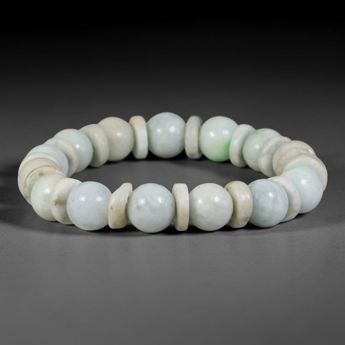 Natural Burmese Type A Pale Celadon Jadeite Bracelet with Off-White Jade Disc Spacers, 54TA: Handcrafted from fully untreated natural Burmese Type A jadeite, this bracelet features smooth pale celadon round main beads paired with off-white and light beige jade disc separators for textured lay