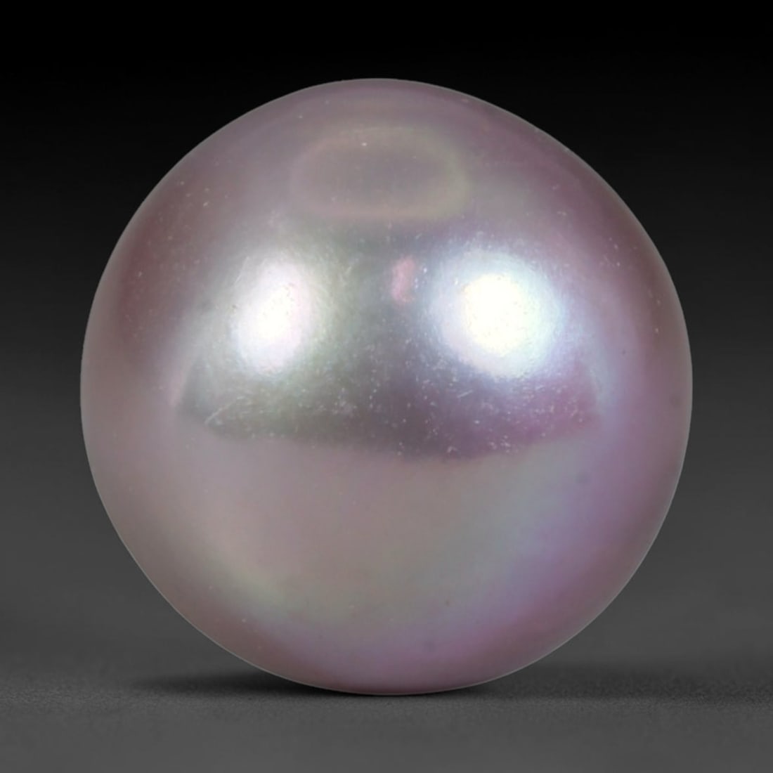 Natural Freshwater Pearl - Muted Lavender Taupe Sphere 11mm, 56WE: This natural freshwater pearl forms a smooth symmetrical spherical body with soft iridescent nacre carrying delicate muted lavender and pale taupe overtones across its polished surface. Fine subtle mi