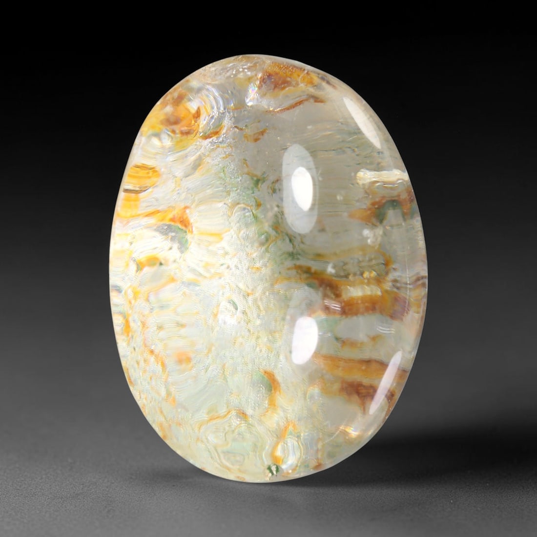 26.68ct Natural Brazilian Phantom Quartz Oval Cabochon Loose Gemstone, 71YX: This smoothly polished cabochon of natural phantom quartz preserves delicate layered phantom crystal formations enclosed inside transparent quartz host. The domed polished surface offers unobstructed 
